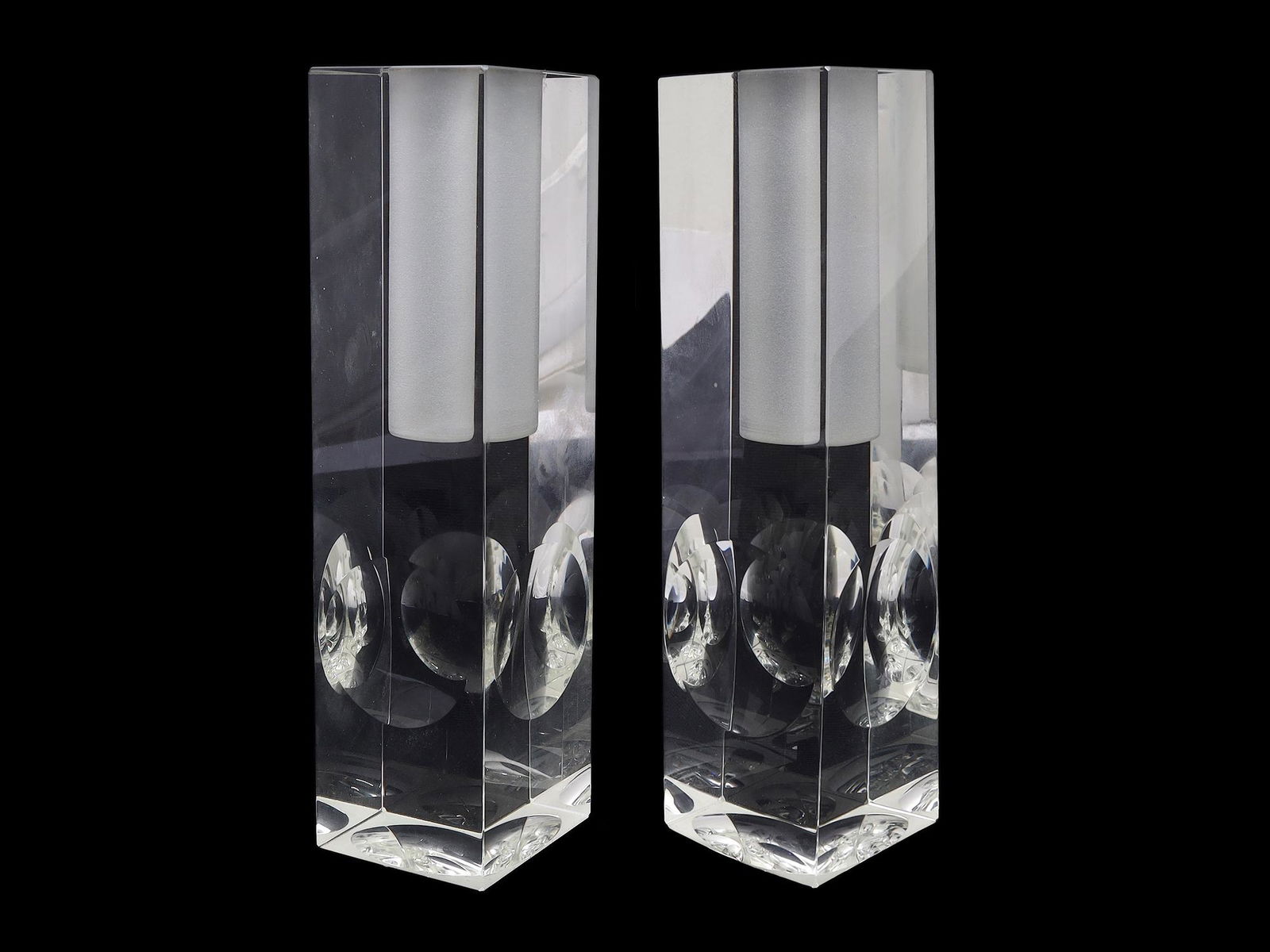 A PAIR OF VINTAGE SOVIET CLEAR GLASS CANDLESTICKS: Two stylish Russian Soviet geometric candlesticks made circa 1930. The design is complemented by spheres at the bottom and on the edges of the candlesticks, which are refracted to create a constructiv