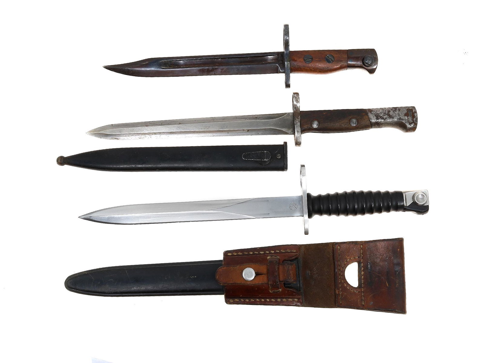 A LOT OF WWII VINTAGE RIFLE BAYONETS: A lot of vintage bayonets including a WW2 British Enfield MkII India pattern bayonet, a Belgian 1949 FN SAFN rifle bayonet SA-30 with a scabbard, and a Swiss STGW 57 bayonet with a frog for the model 