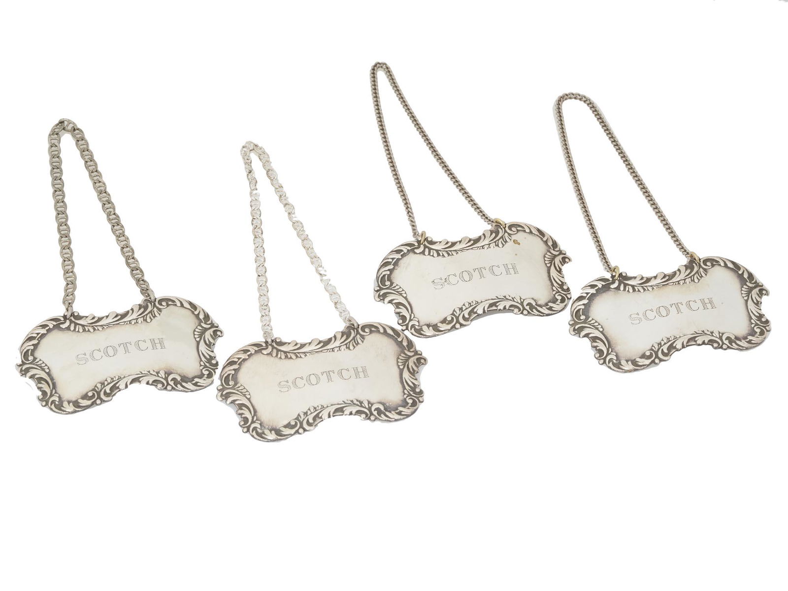 A SET OF SCOTCH STERLING SILVER DECANTER TAGS (1 of 5)