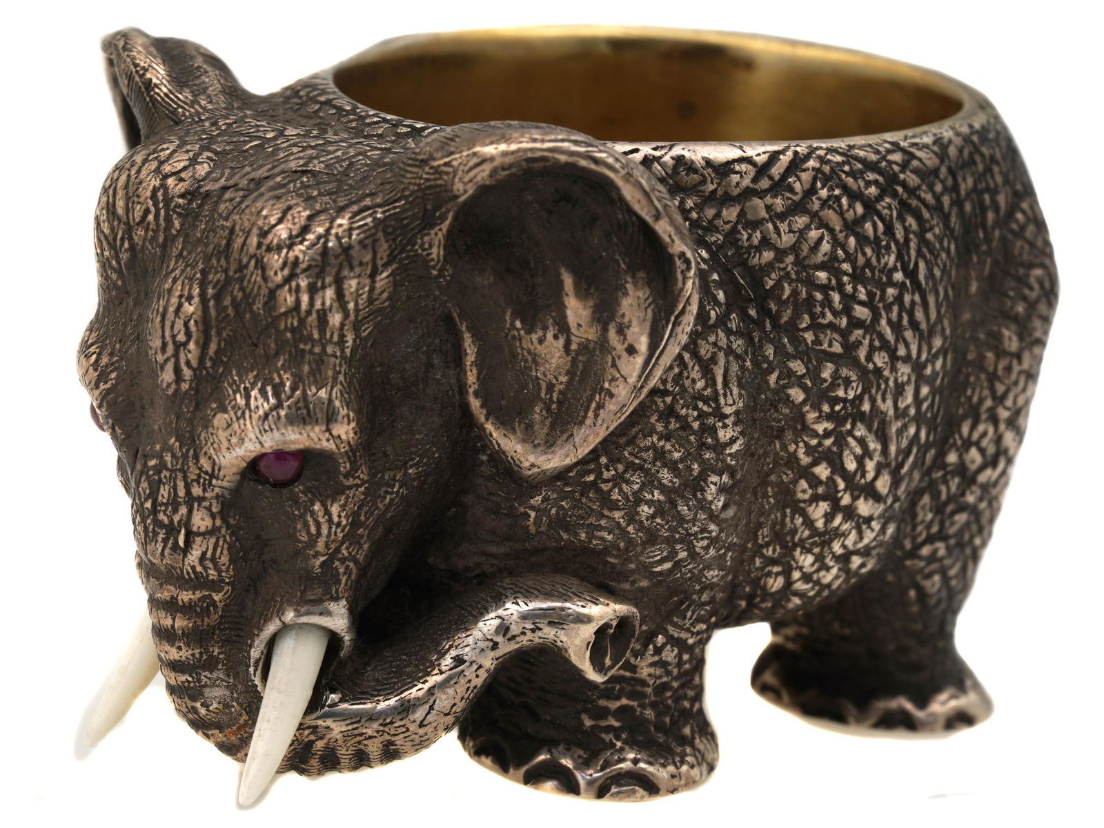 RUSSIAN GILT SILVER ELEPHANT SALT CELLAR FIGURINE: A Russian hand-carved sterling silver figural elephant salt cellar. The figurine is adorned with cabochon stones set to eyes. A gold wash interior. Marked with a silver standard mark and other Assay m
