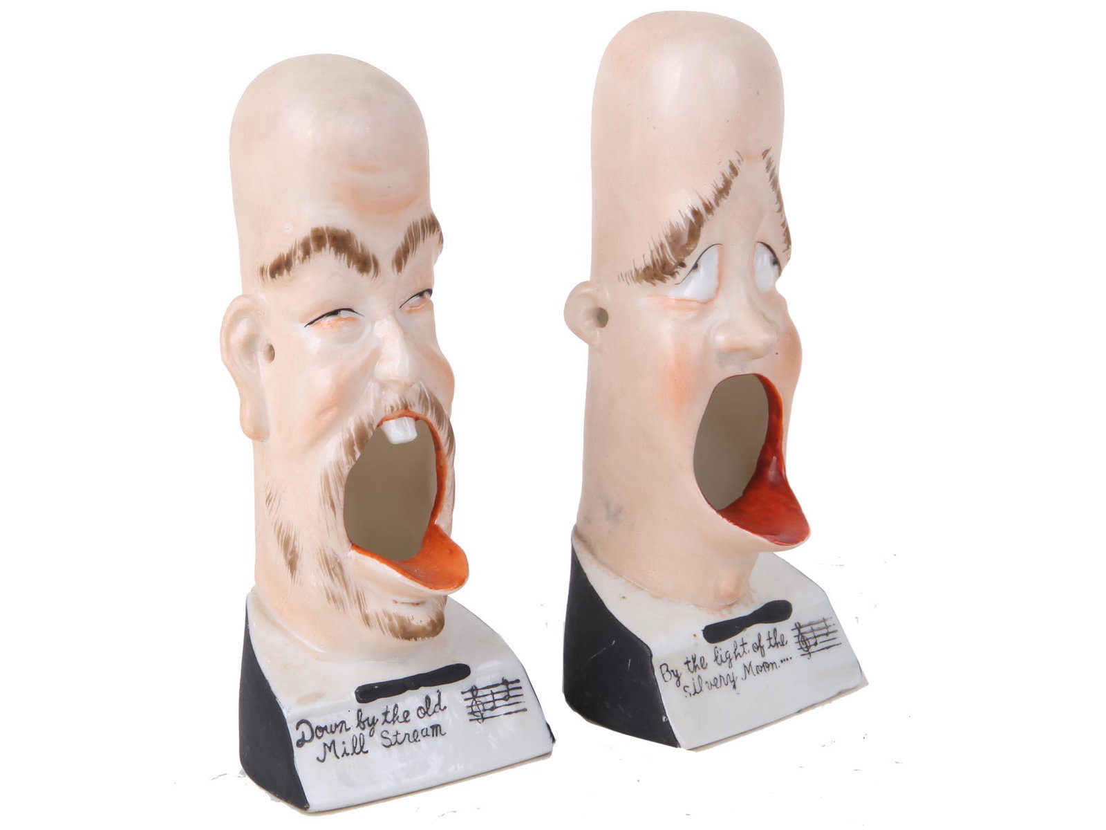 SCHAFER AND VATER PORCELIAN SMOKING ASHTRAYS: Two vintage collectable Schafer and Vater Barbershop Quartet porcelain novelty smoking ashtray figures. Modeled as comic heads singing "Down by the old mill Stream" and "By the light of the silvery mo