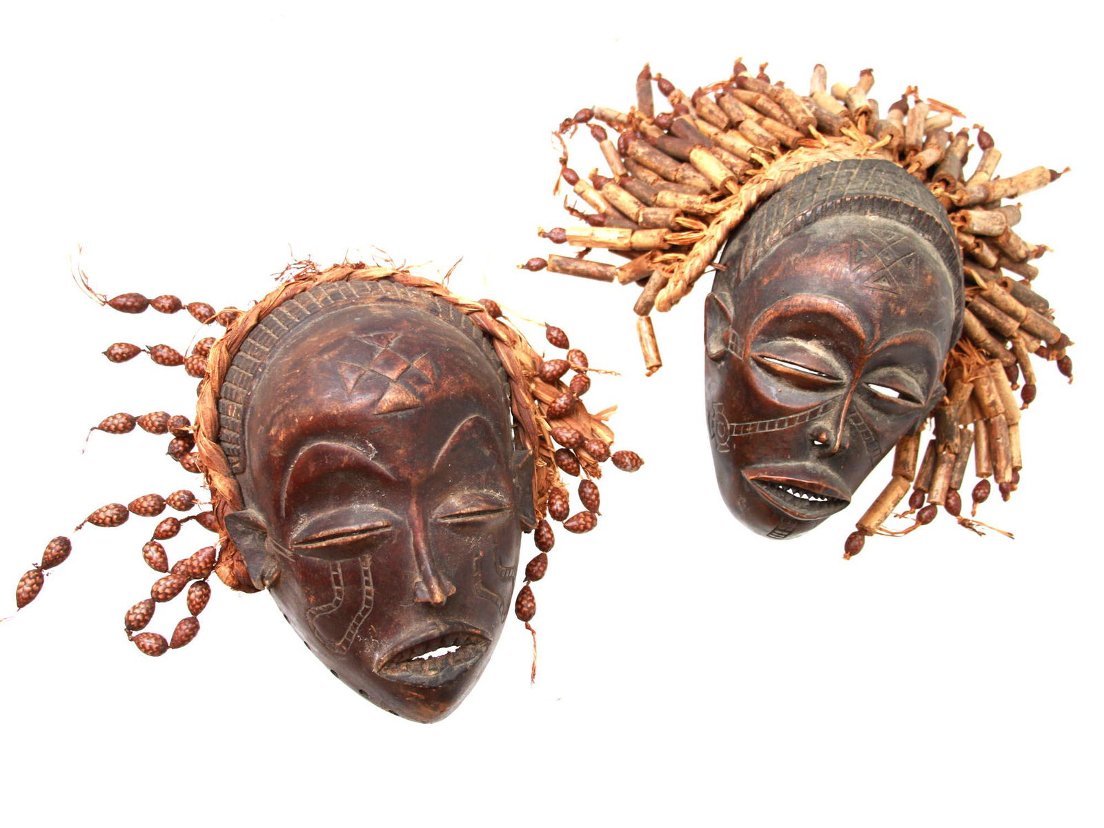 TWO AFRICAN CHOKWE MWANA PWO WOOD MASKS WITH BEADS. (1 of 8)