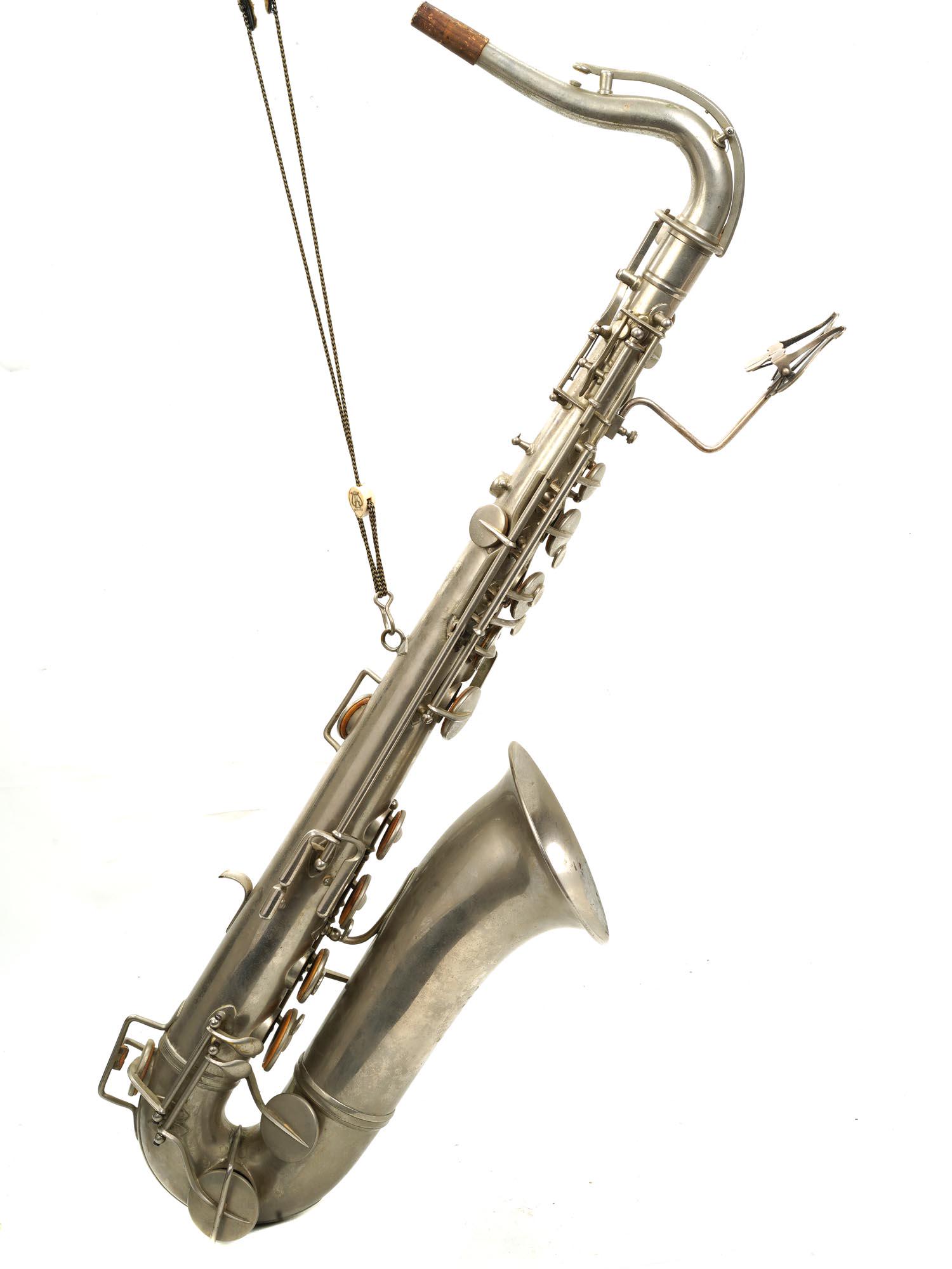 A VINTAGE ITALIAN EARLY 20TH CENT ALTO SAXOPHONE: A vintage silver plated brass alto saxophone manufactured by Prof. Romeo Orsi in Milano, Italy. With all the necessary accessories and in a case. Circa: early 20th century. Dimensions: Cased 37 1/2" x