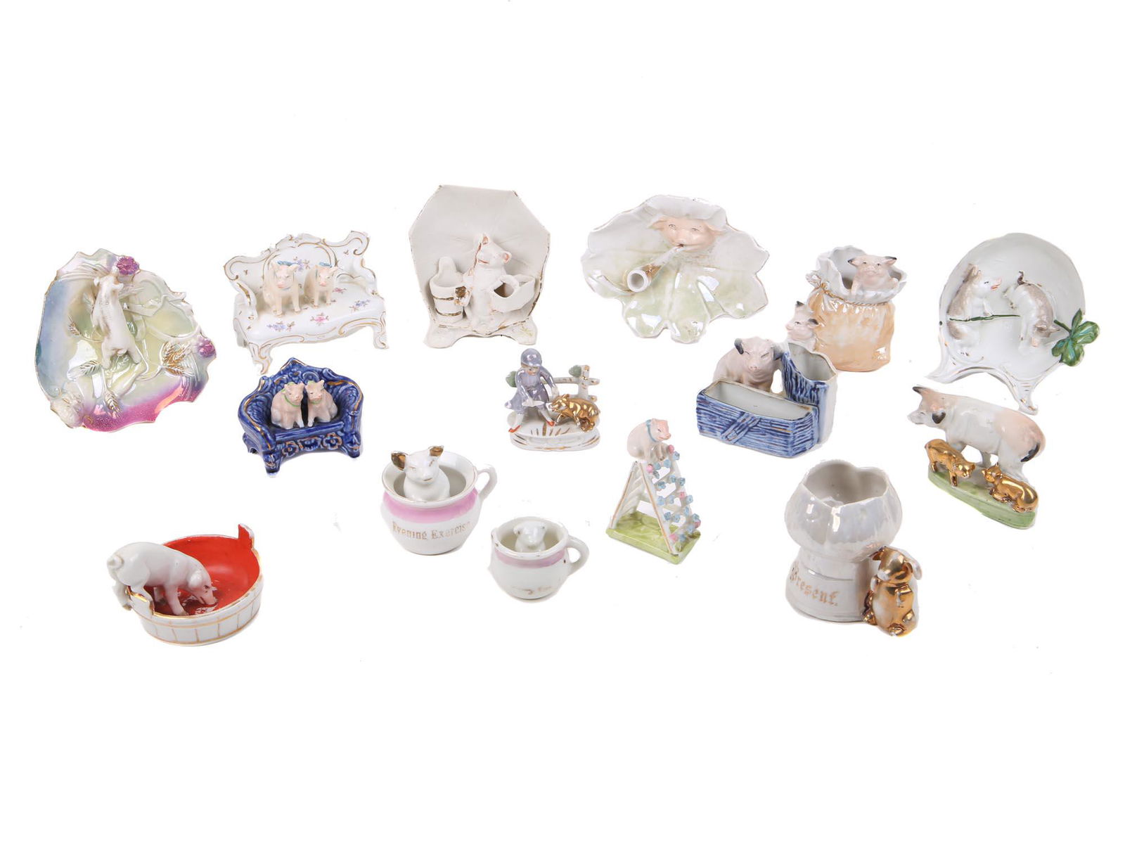 GERMAN PORCELAIN PIGS FIGURINES SOUVENIRS: A lot of various porcelain pigs related figurines, mostly souvenirs and ashtrays. Made in Germany. Circa: mid 20th century. Dimensions: largest item: 4 1/2" x 3" x 2" in. Smallest item: 1 1/4" x 2" x
