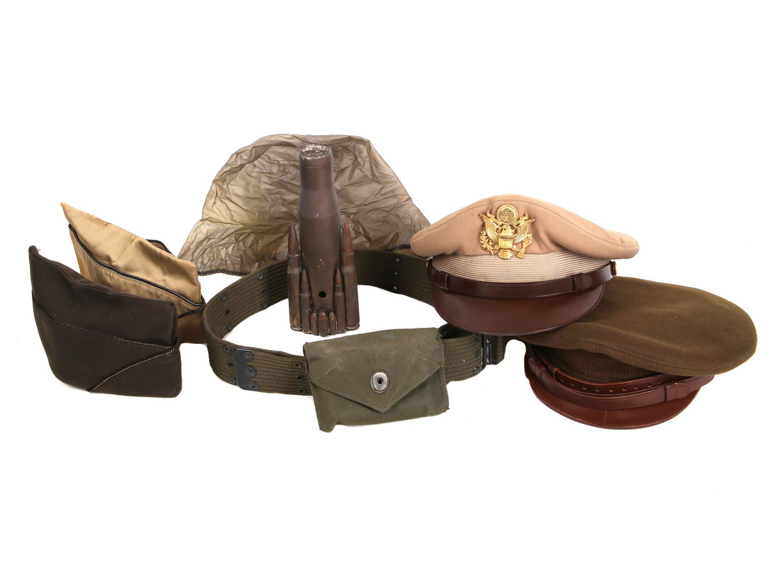 COLLECTION OF MILITARY ITEMS UNIFORM CAPS BELT: A collection of various vintage military uniform items. The collection includes a US WWII officer visor crusher cap with a gold tone eagle insignia badge, an olive green belt marked and numbered insid