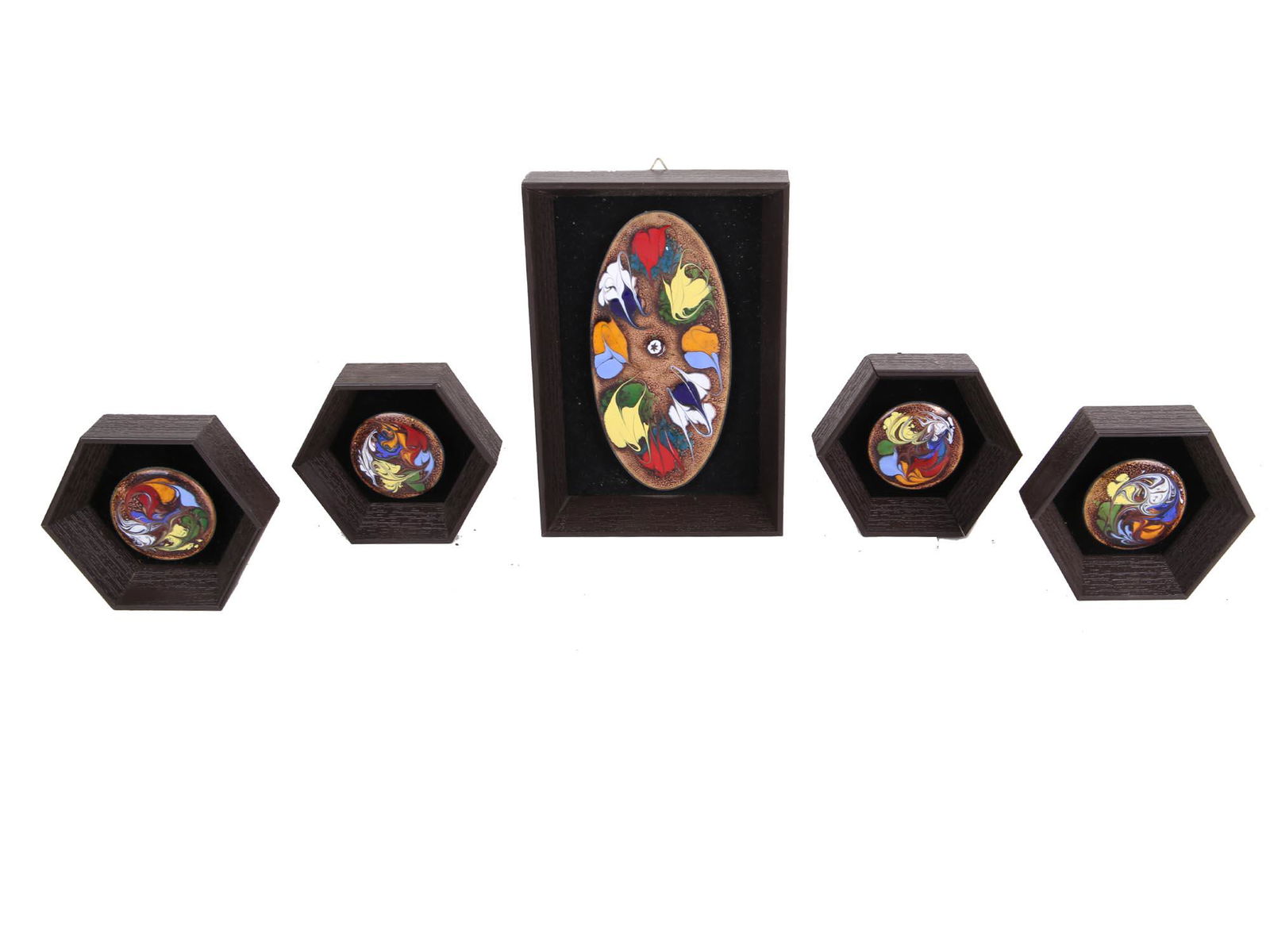 FOILED GLASS WALL DECOR SET MAJ STELLINGER HOUSE: A collection of five vintage framed art glass decorations, hand made in Israel. One oval in a rectangular wooden frame and four round in octagonal wooden frames. Collectible Art Glass Wall Hanging Dec