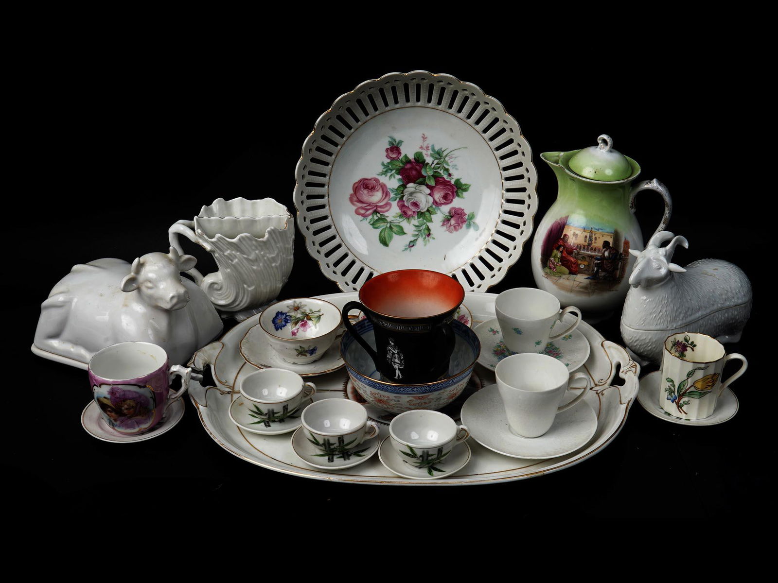A COLLECTION OF VINTAGE PORCELAIN SERVEWARE: Including one big tray with the paint group scene in the middle and stamped on verso with Comte Harrach Karlsbad, Austria, various Japanese, German and Austrian tea cups with the saucers decorated wit