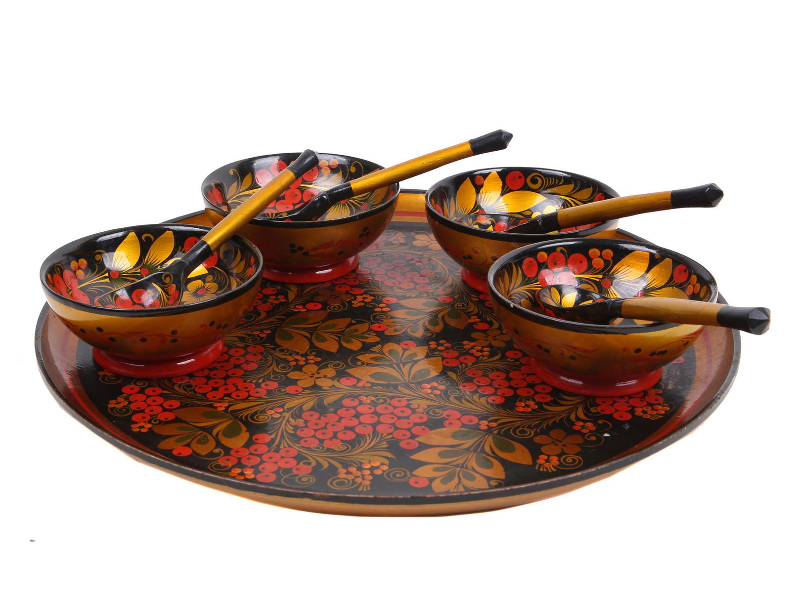 RUSSIAN KHOKHLOMA VINTAGE SERVEWARE COLLECTION: A Russian vintage Khokhloma hand crafted wood set. Contains four bowls, four spoons and a tray. All decorated in a characteristic style of golden, red, and green color on a black background. Dimension