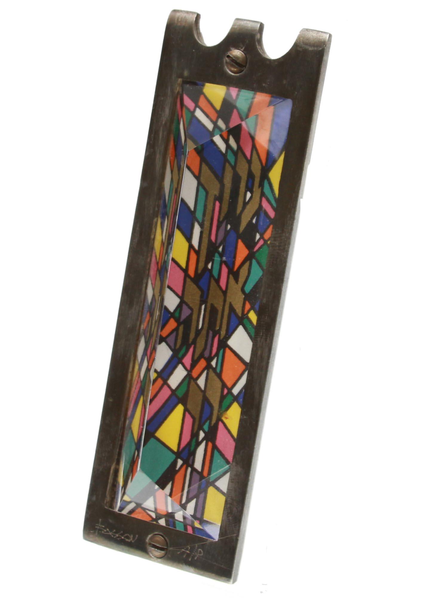 A GLASS MEZUZAH SIGNED BY NOAM NAIM BASSON: Noam Naim Basson (Israeli, b.1935) stained glass Mezuzah in the Pop art style made of glass, paper, lucite and silver. Singed by the author. Circa: 1980s. Dimensions: H: 5 in.