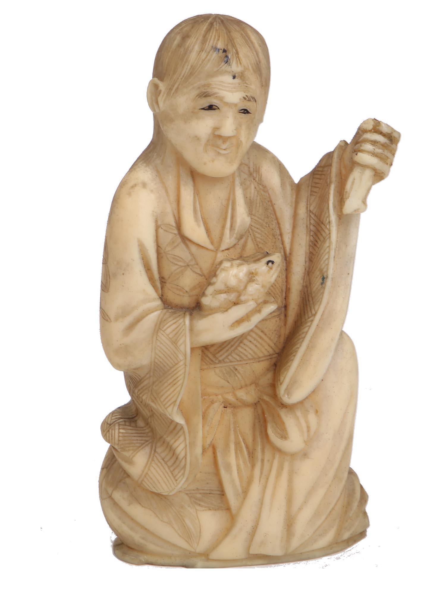 A SMALL JAPANESE HAND CARVED NETSUKE FIGURINE: A small Japanese hand-carved from natural materials delicate netsuke figurine of an old man holding a frog in his right hand. The figurine is adorned with hand-painted accents. Dimensions: 3 1/8" in T