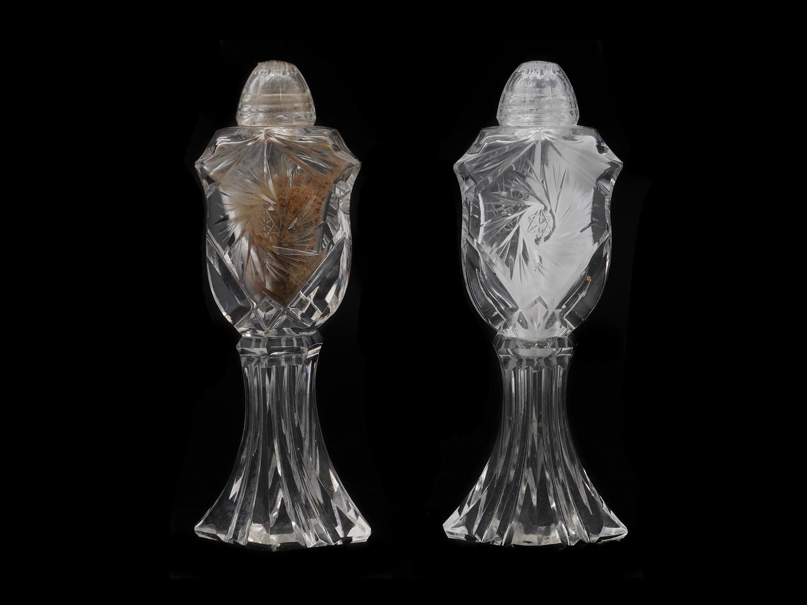 PAIR OF ANTIQUE TALL FOOTED ETCHED GLASS SHAKERS: Two large and heavy hand cut glass salt and pepper shakers. The shield shaped body is elaborately cut and raised on a cut stem. Possibly Czech, early 20th century. Cut Glass Serveware, Home Decor, Ant