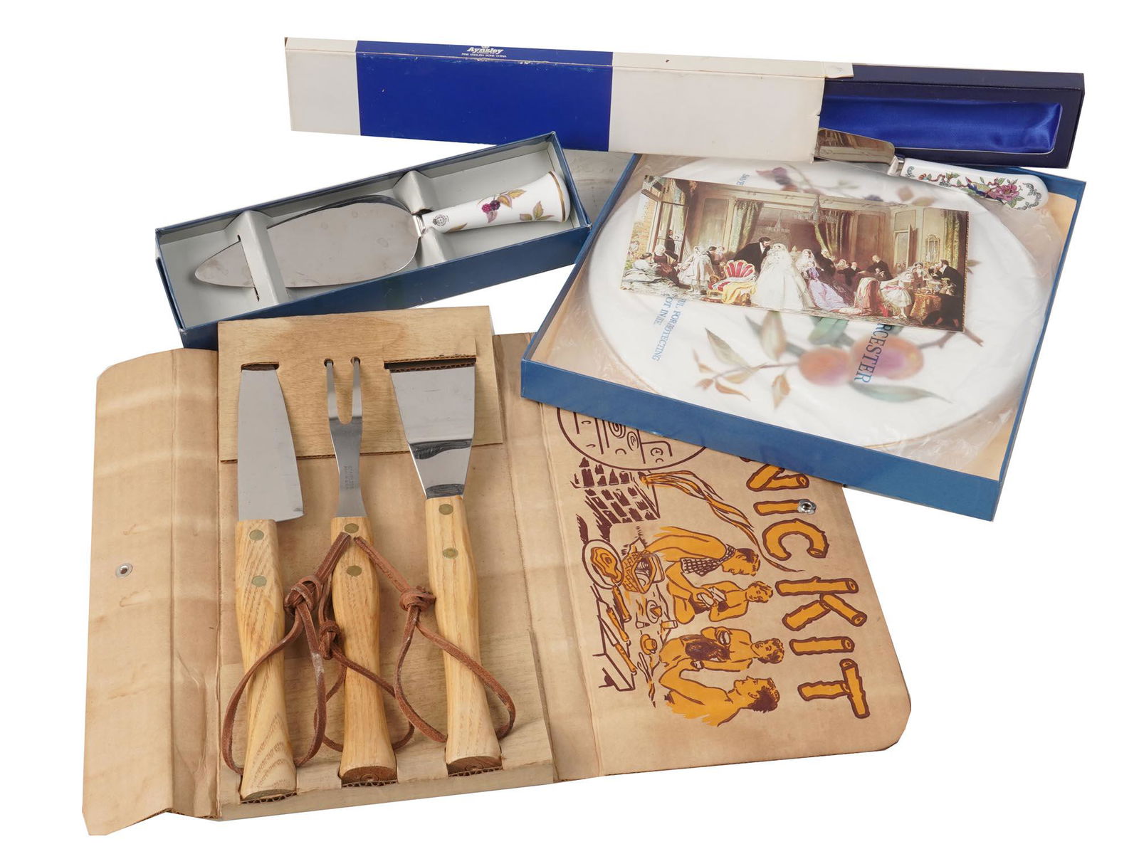 VINTAGE MID CENTURY SERVEWARE UTENSIL ITEMS IOB: Includes a vintage Mid Century Clyde BBQ Picnic Kit in the original box. This is a three piece utensil set for camping or BBQ. The utensils have wood handles and are marked Cornell Flux Stainless. a R