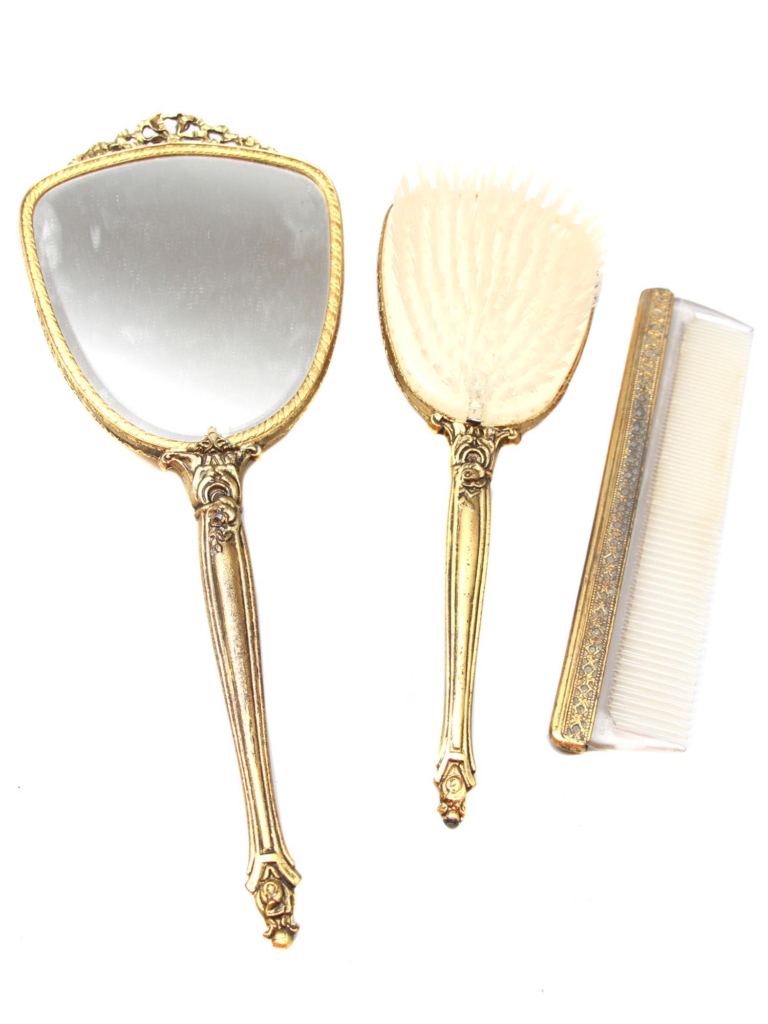 A VINTAGE GILDED THREE-PIECE VANITY SET (1 of 8)