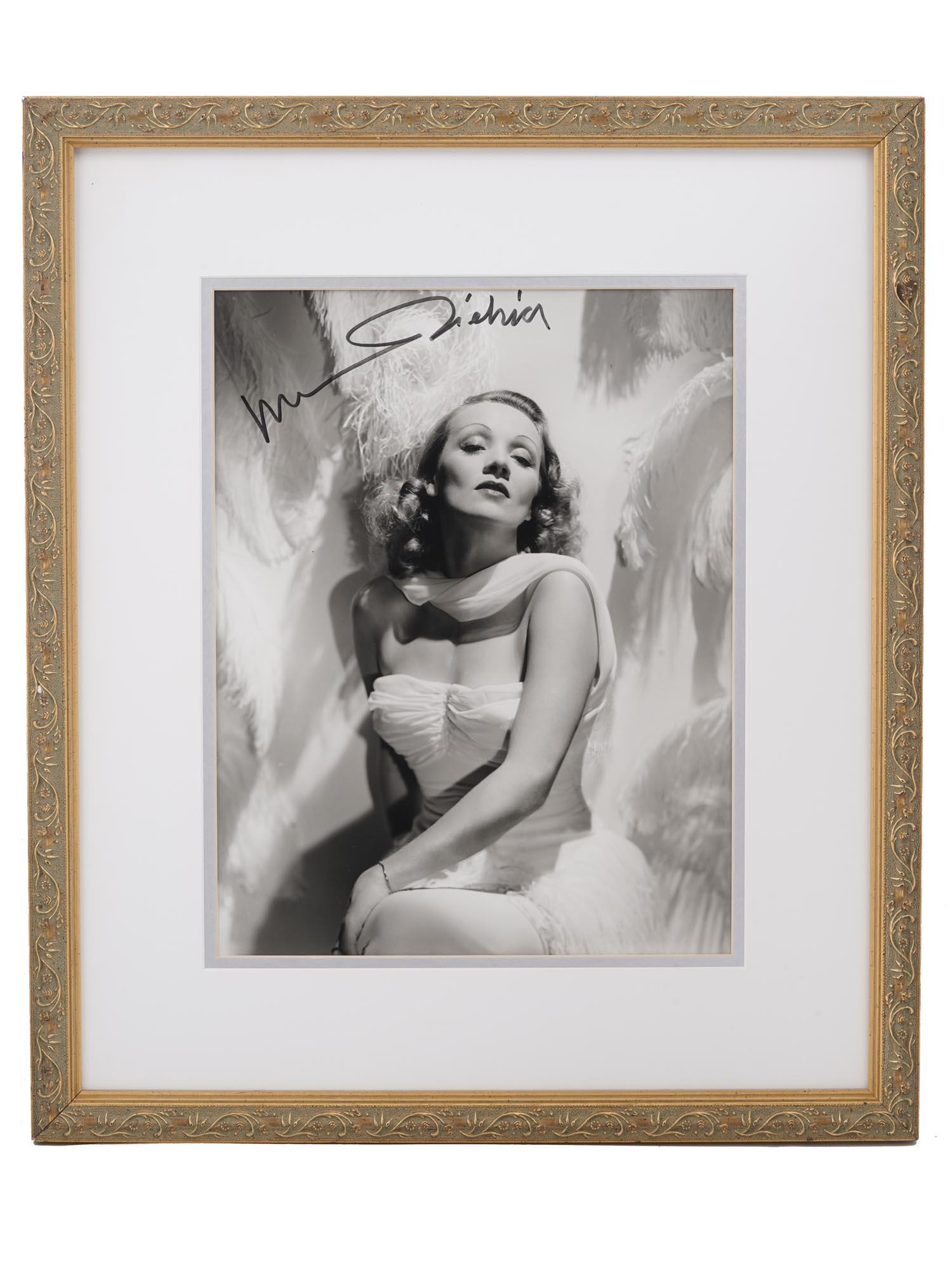 VINTAGE AMERICAN SIGNED PHOTO OF MARLENE DIETRICH: A vintage black and white photo of Marlene Dietrich with an original autograph of the actress. The photo was made by George Edward Hurrell (1904-1992), a photographer who contributed to the image of g