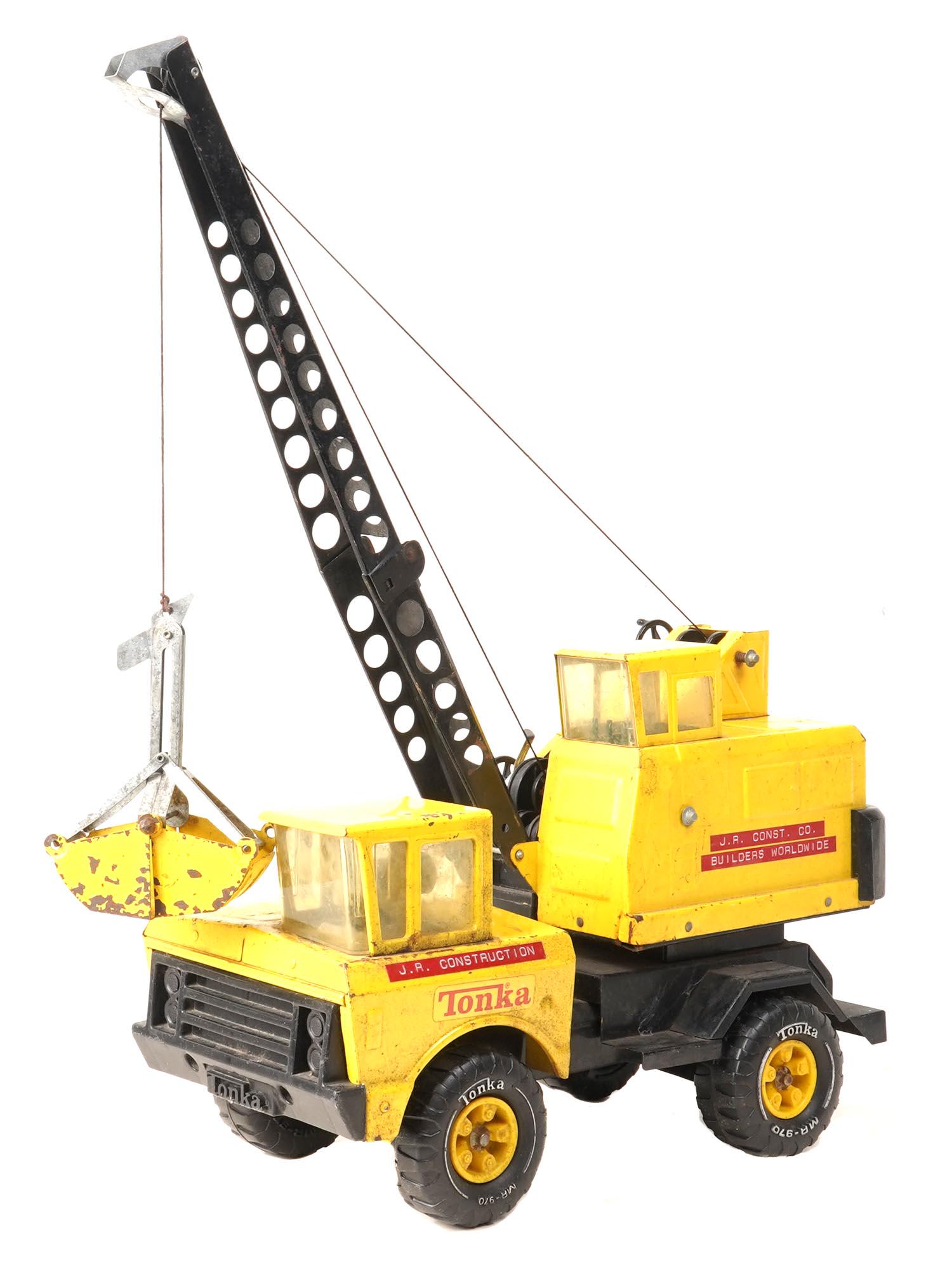 VINTAGE AMERICAN ORIGINAL TONKA STEEL TOY CRANE: A vintage American pressed steel classic crane by Tonka. The grader body is in a classy yellow. Tonka car toy collectibles. Dimensions: 27 1/2" in Tall. 17" in Length. 7 1/4" in Wide. All measurements