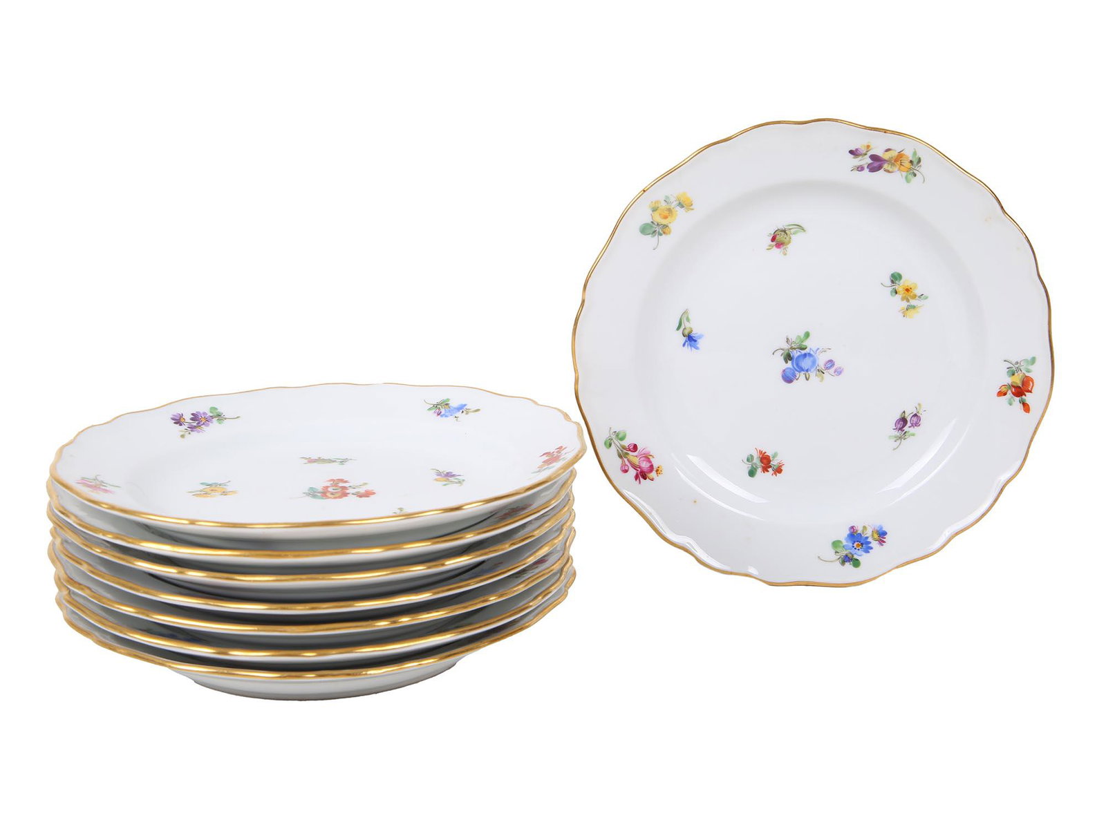EIGHT ANTIQUE MEISSEN PORCELAIN DESSERT PLATES: Eight antique porcelain dessert plates manufactured by Meissen. The pieces are delicately hand painted with polychrome sprays of flowers and feature gilt rims throughout. Marked to the underside with 