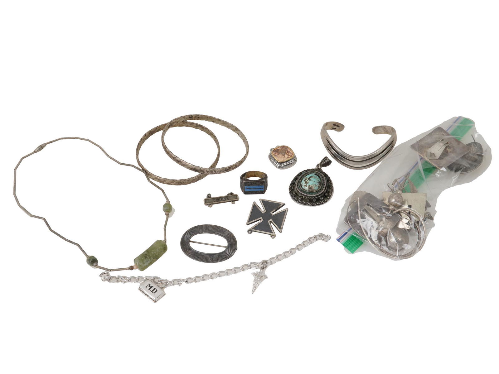 VINTAGE STERLING SILVER JEWELRY AND SCRAP PIECES: A collection of vintage sterling silver ladies jewelry. The lot includes a Jewish silver piece marked with Hebrew inscription and 925 silver standard, a bracelet with jewelry pendants marked Sterling,