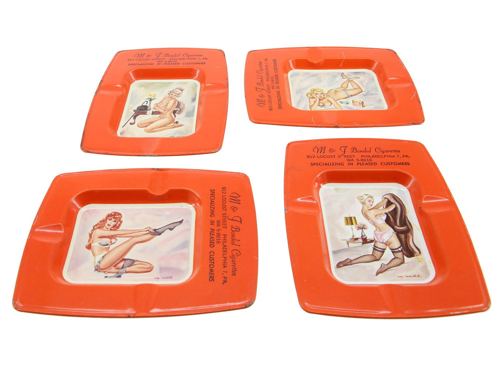 MID CENTURY TIN METAL PIN UP GIRLS ASHTRAYS SET: A Mid century American set of four M & J Bonded Cigarettes red tin metal cigarette ashtrays. The ashtrays are decorated with images of Pin Up Girls. Each is signed by the artist lower right. Marked on