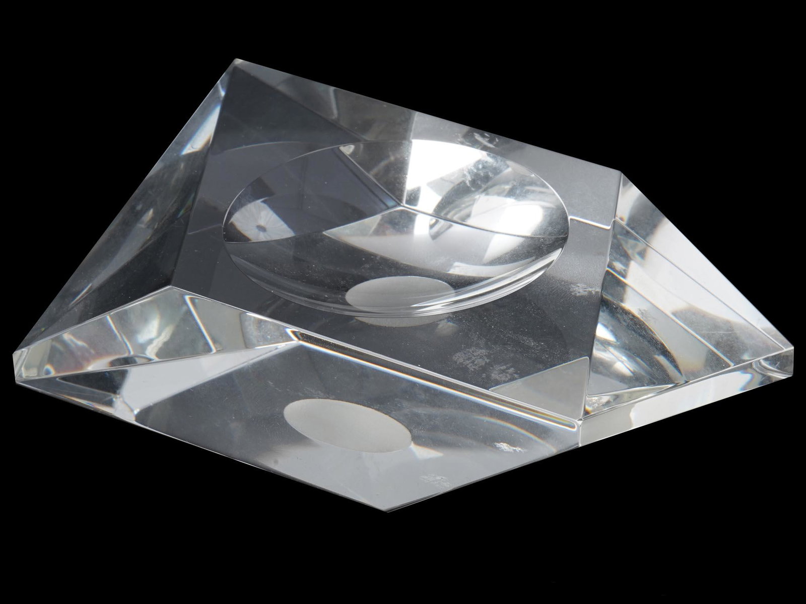 A SOVIET 1930S AVANT GARDE STYLE CRYSTAL ASHTRAY: A Russian Soviet 1930's laconic crystal ashtray with crisp edges. Dimensions: 4 7/8" in. Length. All measurements are approximate.