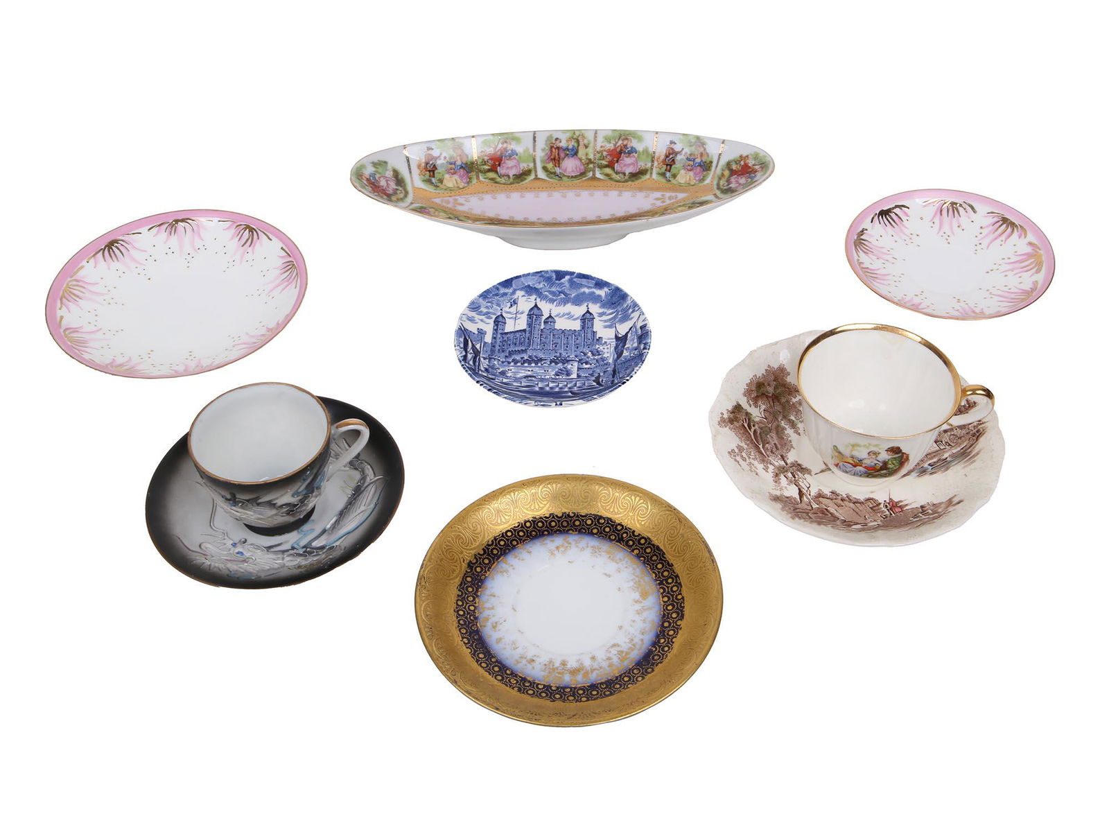 COLLECTION OF VINTAGE PORCELAIN SERVEWARE: The lot includes two Jiesia Lithuanian vintage porcelain plates painted in pink and gold and teacup hand painted with a courting couple, a set of vintage Japanese teacup and saucer decorated with a ha