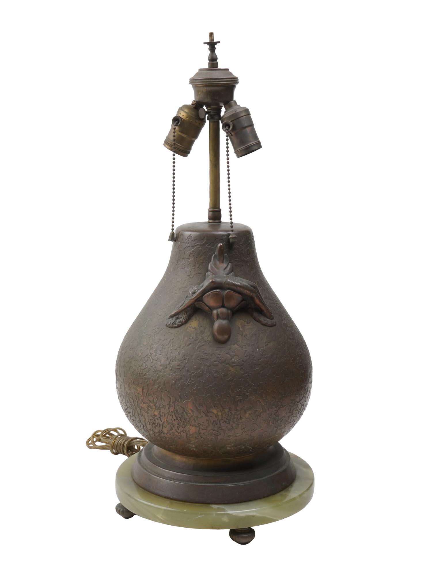 ART DECO FLAPPERS ERA OLIVE KOOKEN TABLE LAMP: A fine Olive Kooken, American, 1904-1964, Art Deco bronze figural table lamp, bulbous textured font ornamented with two reclining nude female figures, mounted on a round natural onyx base raised on fo