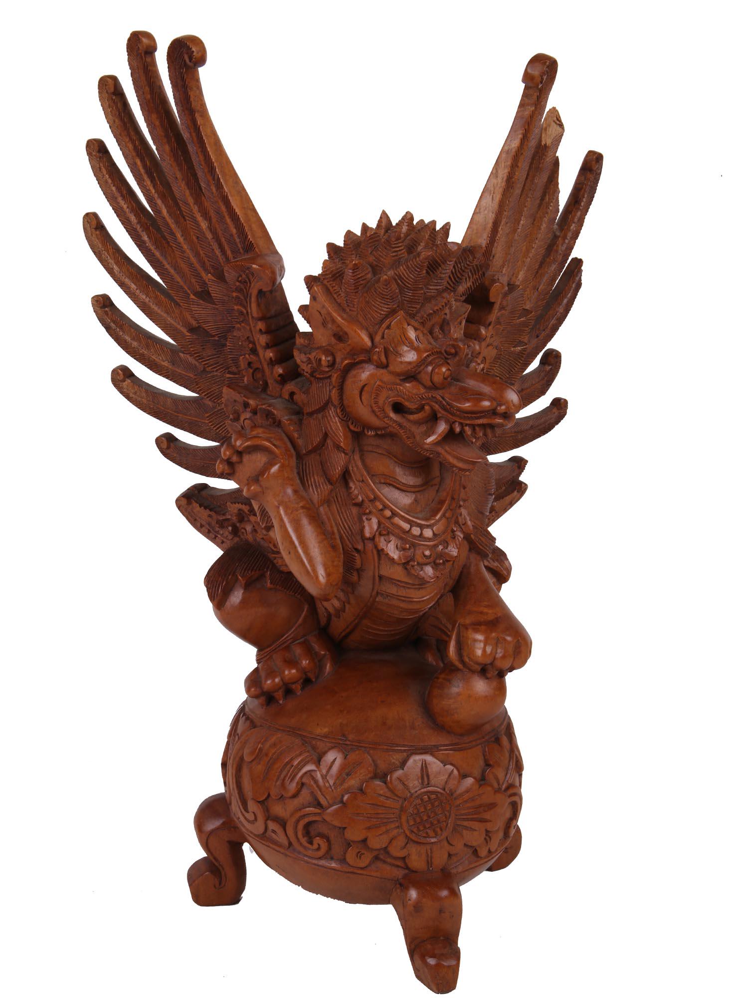 INDONESIAN BALINESE GUARDIAN WINGED LION STATUE: A vintage Indonesian art Balinese high detail and hand carved in very hard dense wood statue of a guardian winged statue. A winged lion (called a singha) temple or palace guardian. Circa: 20th century