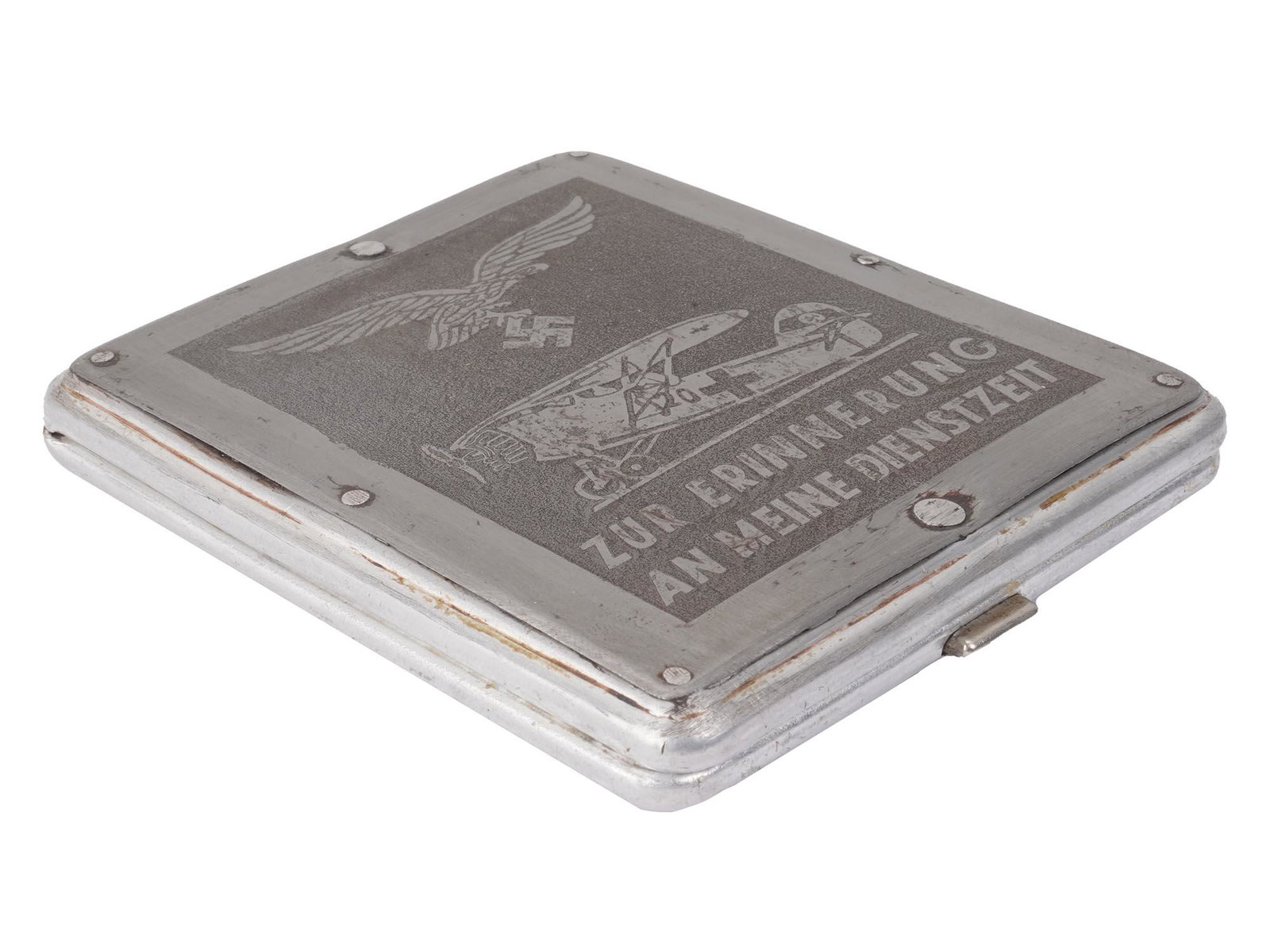 WWII GERMAN NAZI THIRD REICH CIGARETTE CASE: A German Nazi cigarette case from the WWII period. Made of white color metal, the lid is decorated with an image of an eagle flying with a swastika in its claws over the plane and inscribed with the s