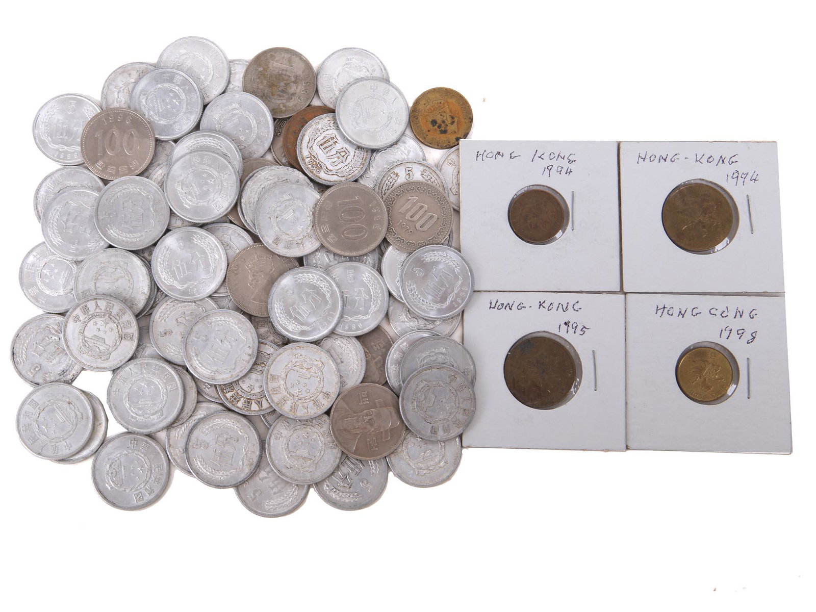 COLLECTION OF VINTAGE ASIAN MOSTLY CHINESE COINS: A large collection of antique and vintage Asian, mostly Chinese, coins. The collection includes a pair of 1994 Hong Kong coins, a 1995 Hong Kong, a 1998 Hong Kong, a 1953 Burma coin, a Siam porcelain 