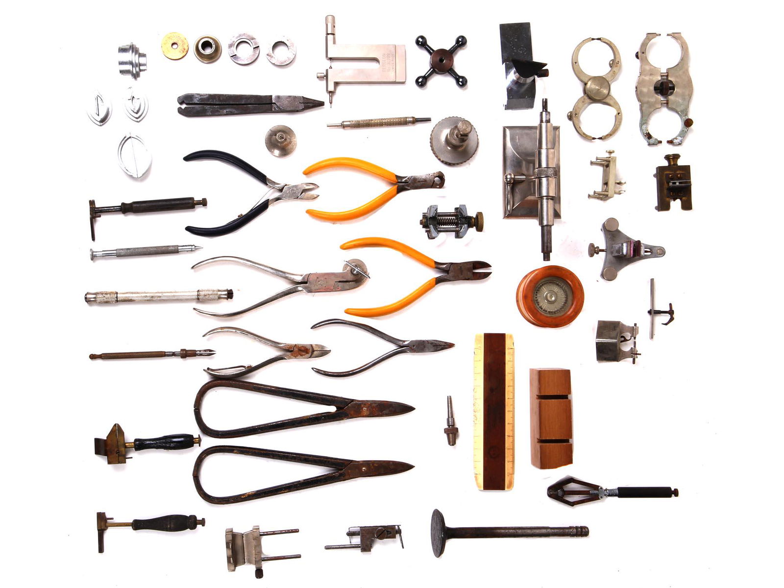 ANTIQUE METAL WATCH REPAIR TOOL COLLECTION: A collection of antique metal watch repair tools including various tweezers, movement tools, spring bar tools, movements holders, watch case presses, grip screwdrivers, and more. Antique Watch Tools.
