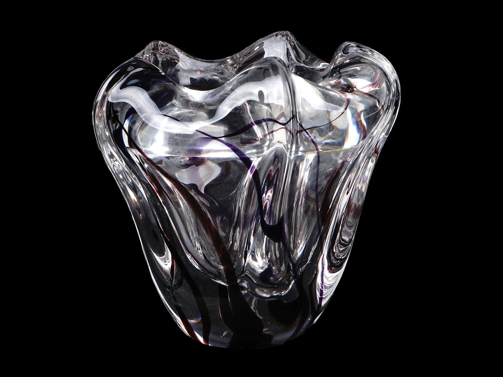 BACCARAT MODERNIST HEAVY CRYSTAL VASE ART GLASS: A heavy crystal vase made by Baccarat, a French manufacturer of fine crystal. An unusual curved shape resembling a half-open flower bud. Thick transparent sides with violet stains executed in the art 