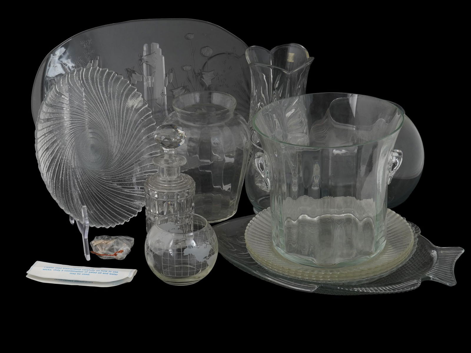 VINTAGE CUT AND CARVED GLASS TABLEWARE VASES: A set of vintage crystal glass tableware. A total of 14 items. The lot includes serving dishes, vases, a cut glass decanter, a decorative carved glass tray. Collectible Glass Serveware For Kitchen Des