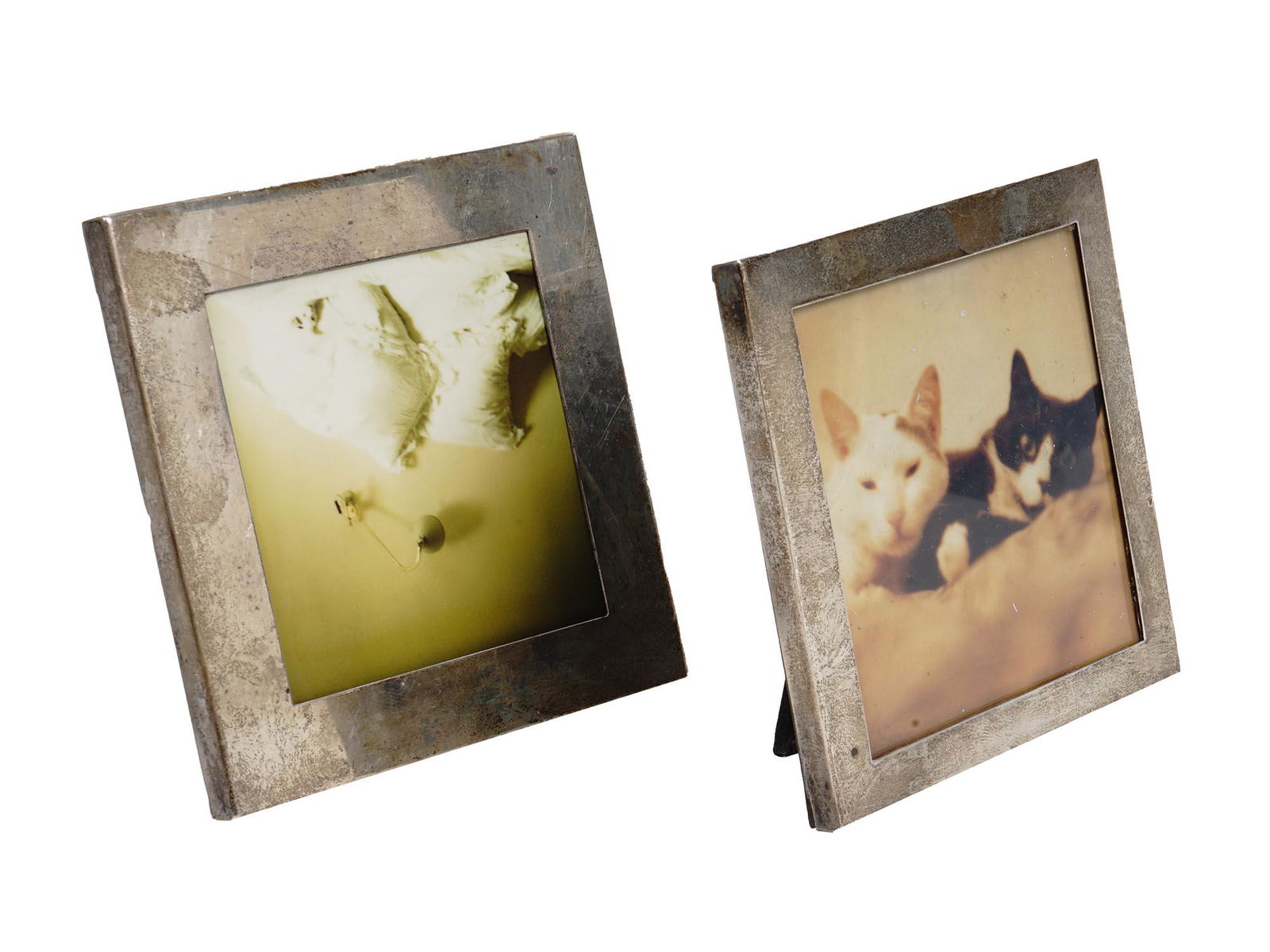 TWO SQUARE STERLING SILVER PHOTO FRAMES TIFFANY: A set of two square-shaped solid sterling silver photo frames. Both frames have hallmarks on the sides. One of the frames have a Tiffany & Co. hallmark, made in Italy. Weight - 167.4 grams. Vintage Si