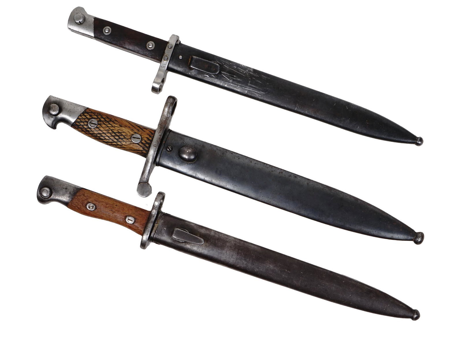 A LOT OF THREE WWII BAYONETS.: 1st- Austrian bayonet WW I - WWII for 1895 Mannlicher M95. 2nd-Spanish Model 1941 Mauser Rifle Bayonet Toledo Arsenal. 3rd-Siamese Mauser 1903 Type 45 bayonet. Dimensions: Largest Item L 15 5/8 in. Sm