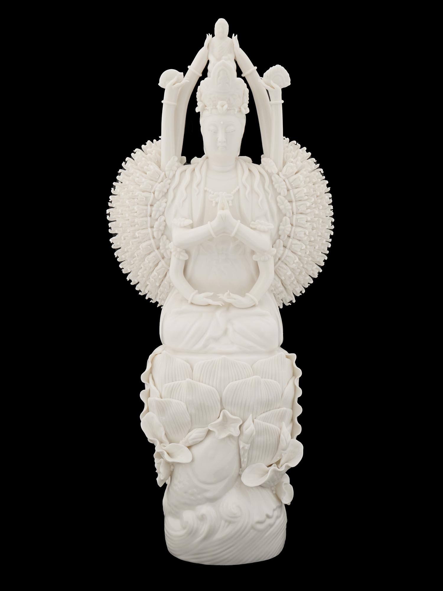 OLD CHINESE DEHUA WHITE PORCELAIN GUANYIN STATUE: An Old Chinese Dehua high quality detailed white porcelain statue of Guanyin with eight immortals hands. Circa: late 19th century to early 20th century. Guanyin is a character of Chinese, Vietnamese, 