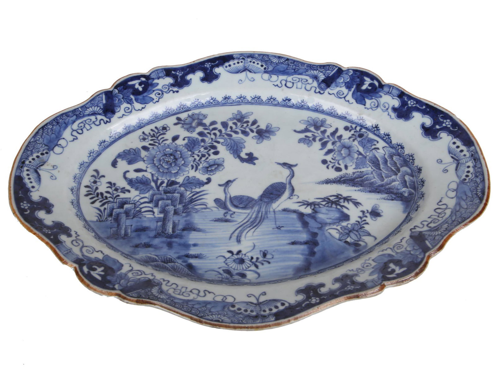 ANTIQUE CHINESE OVAL BLUE WHITE PORCELAIN TRAY: An antique Chinese export oval blue and white glazed porcelain tray. The tray is hand painted with traditional floral, cranes, and landscape motifs to the center and around the rim. Unmarked. Circa: l