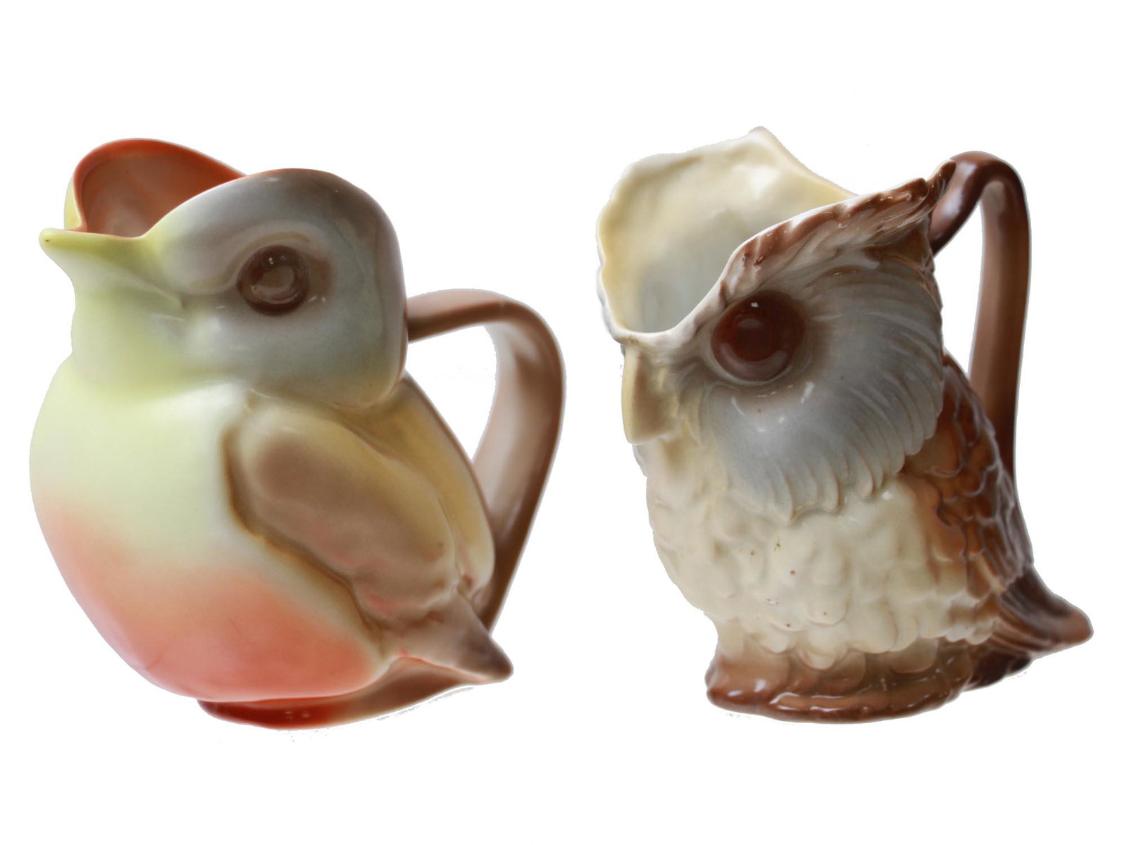 A LOT OF TWO ROYAL BAYREUTH VINTAGE BIRD CREAMERS: Two vintage Royal Bayreuth, Bavaria figural creamers, shaped like a robin bird and an owl. Dimensions: H: 3 7/8 in. Each.