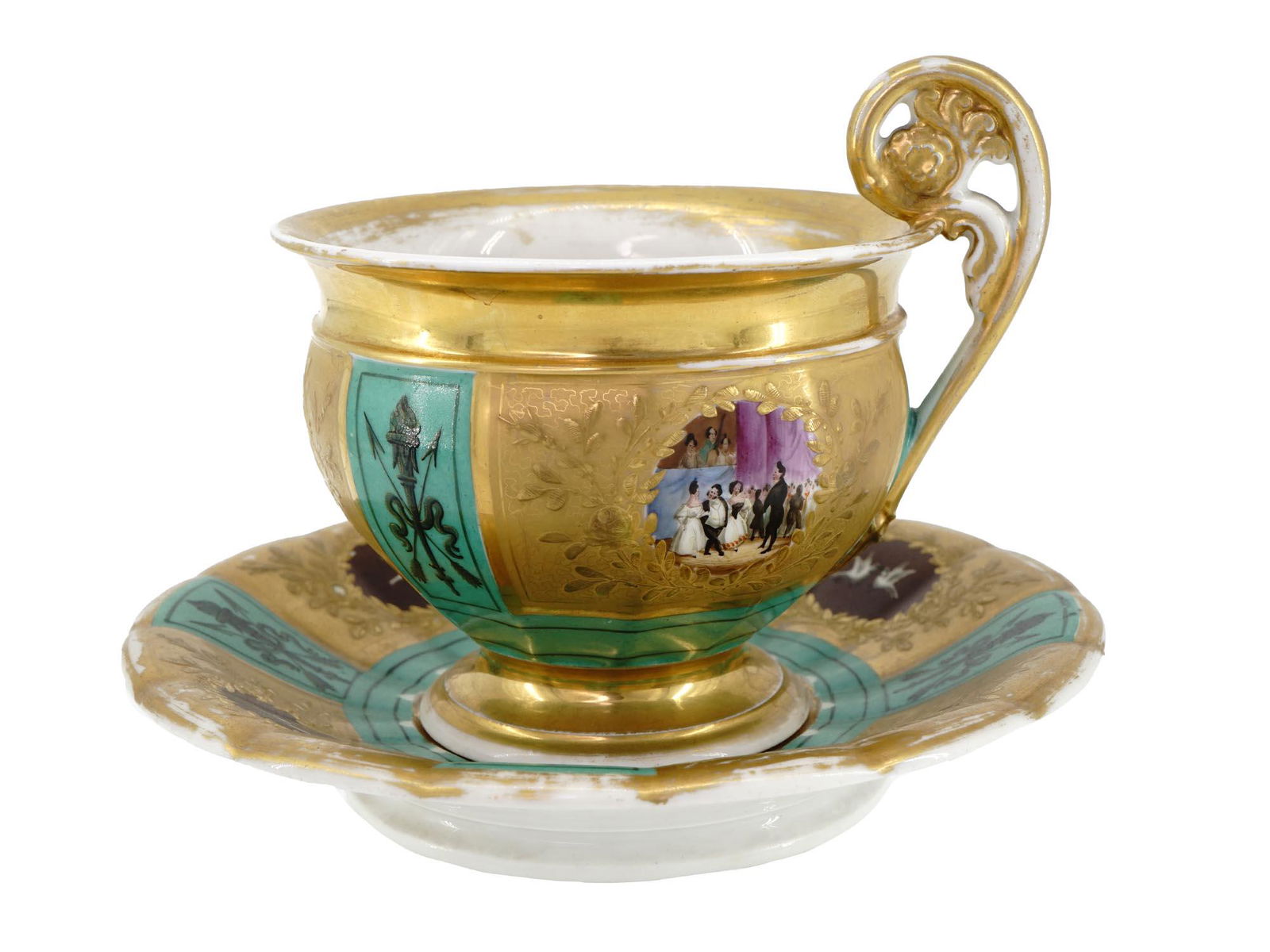 ANTIQUE RUSSIAN GILT PORCELAIN TEA CUP W SAUCER: An antique 19th-century Russian porcelain tea pair, a cup with figurative handle and a saucer, by A.T. Safronov's porcelain manufacture that specialized in Empire-style tableware. Both pieces have ric