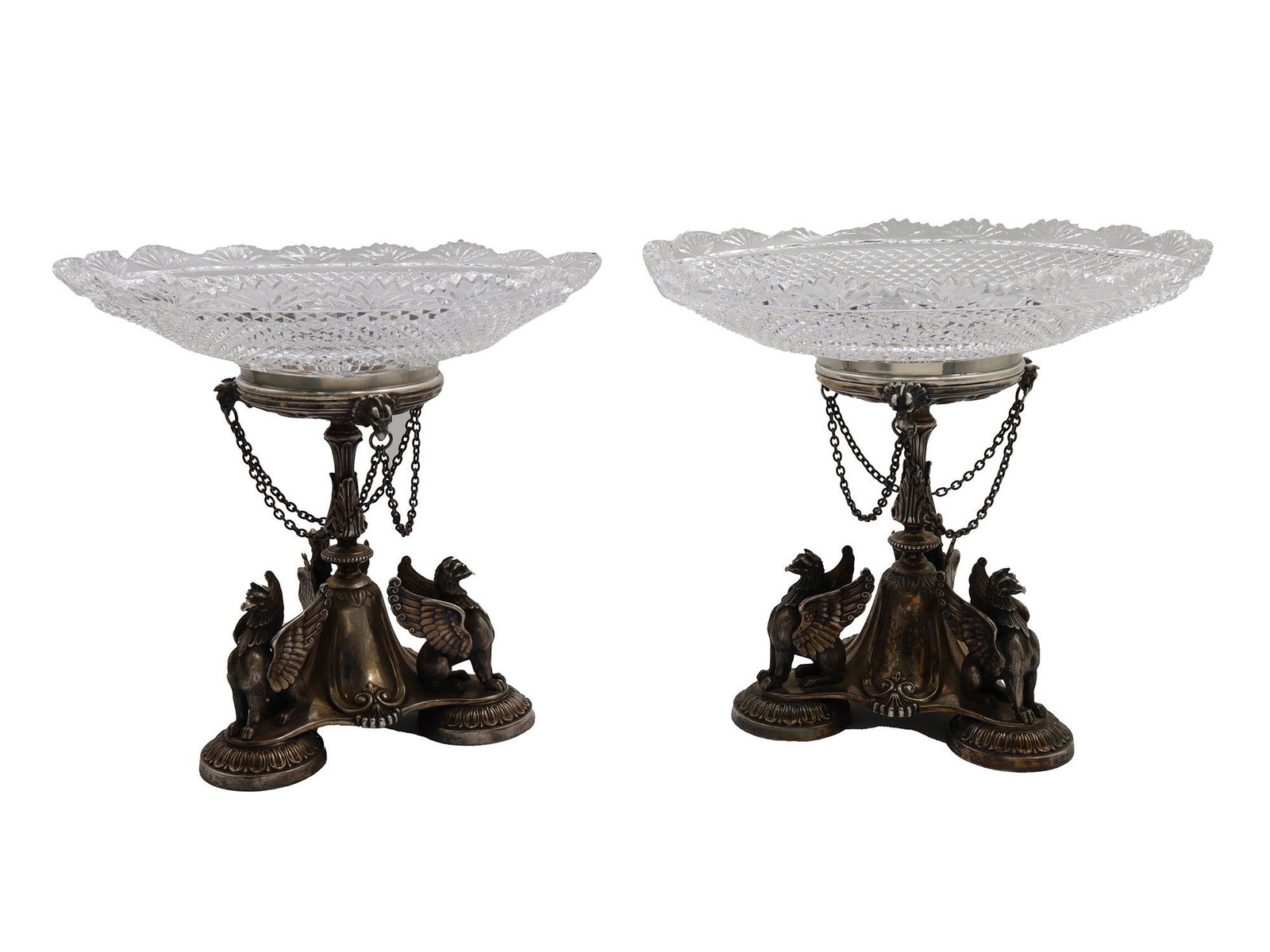 THOMAS BRADBURY & SONS SILVER PLATED CENTERPIECES: A pair of antique fine quality Victorian silverplate centerpieces stands by Thomas Bradbury and Sons. Circa: 1865. Decorated with four relief sculptures of seated griffins and griffins heads holding h