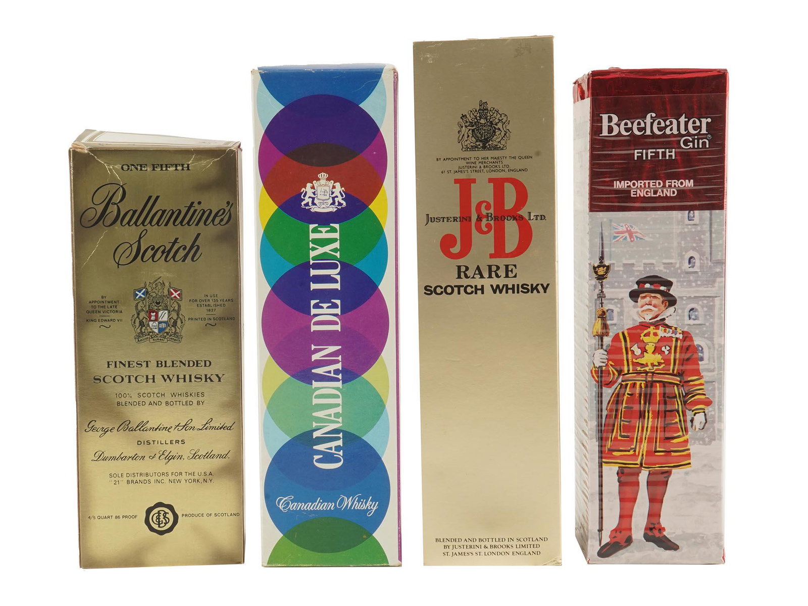 FOUR SEALED ALCOHOL BOTTLES IOB VINTAGE ITEMS: Four vintage sealed alcohol bottles including a Ballantines Scotch, Finest Blended Scotch Whiskey, blended and bottled in Scotland. Imported Canadian DeLuxe Whiskey, A blend, 6 years old. Justerini an