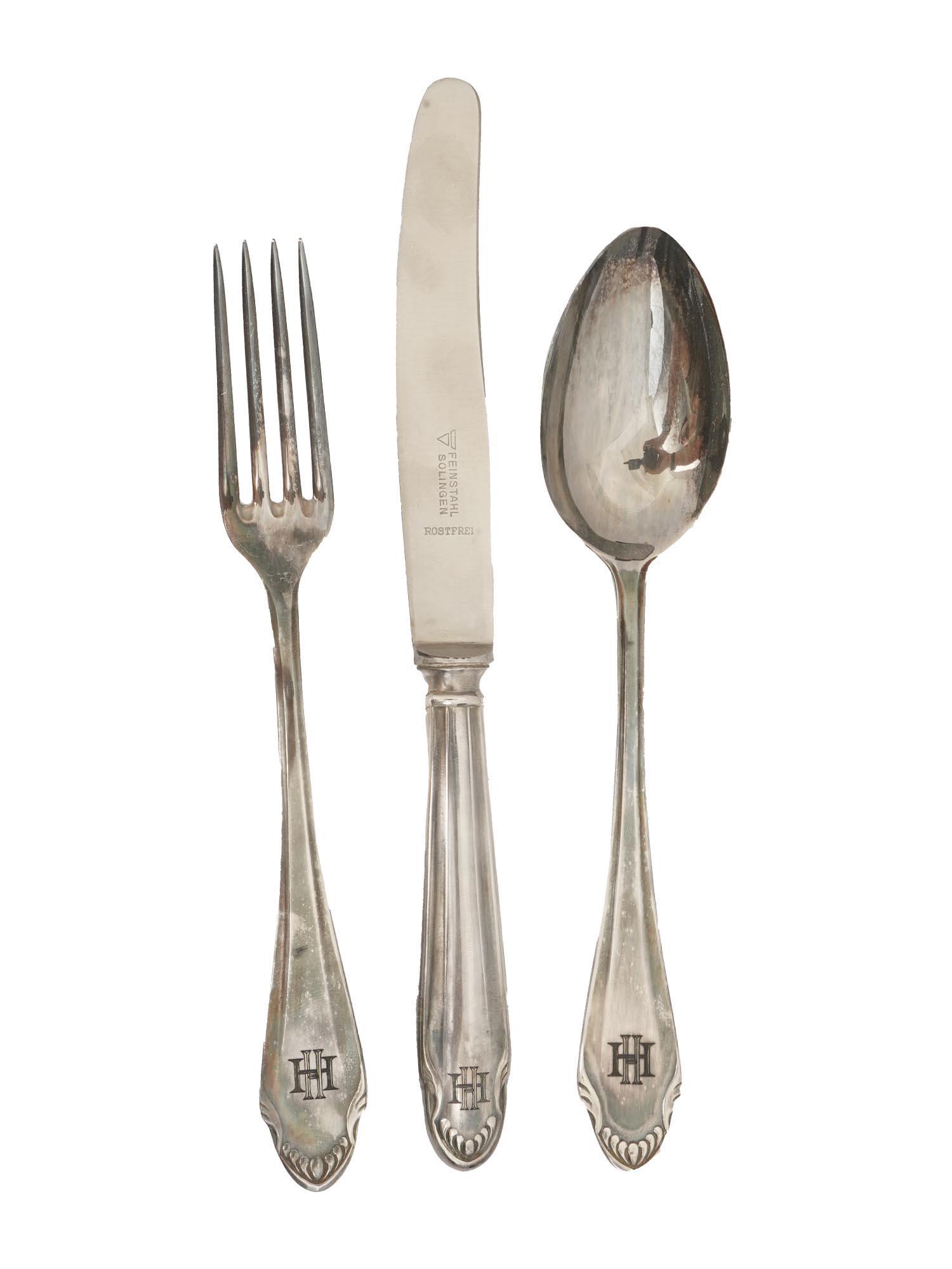 NAZI GERMAN HEINRICH HIMMLER SPOON FORK AND KNIFE: A set of silver plated steel fork, knife and spoon decorated with the HH initials for Heinrich Himmler. The handles of the fork and the spoon are hallmarked with 90 silverplate marks. The blade of the