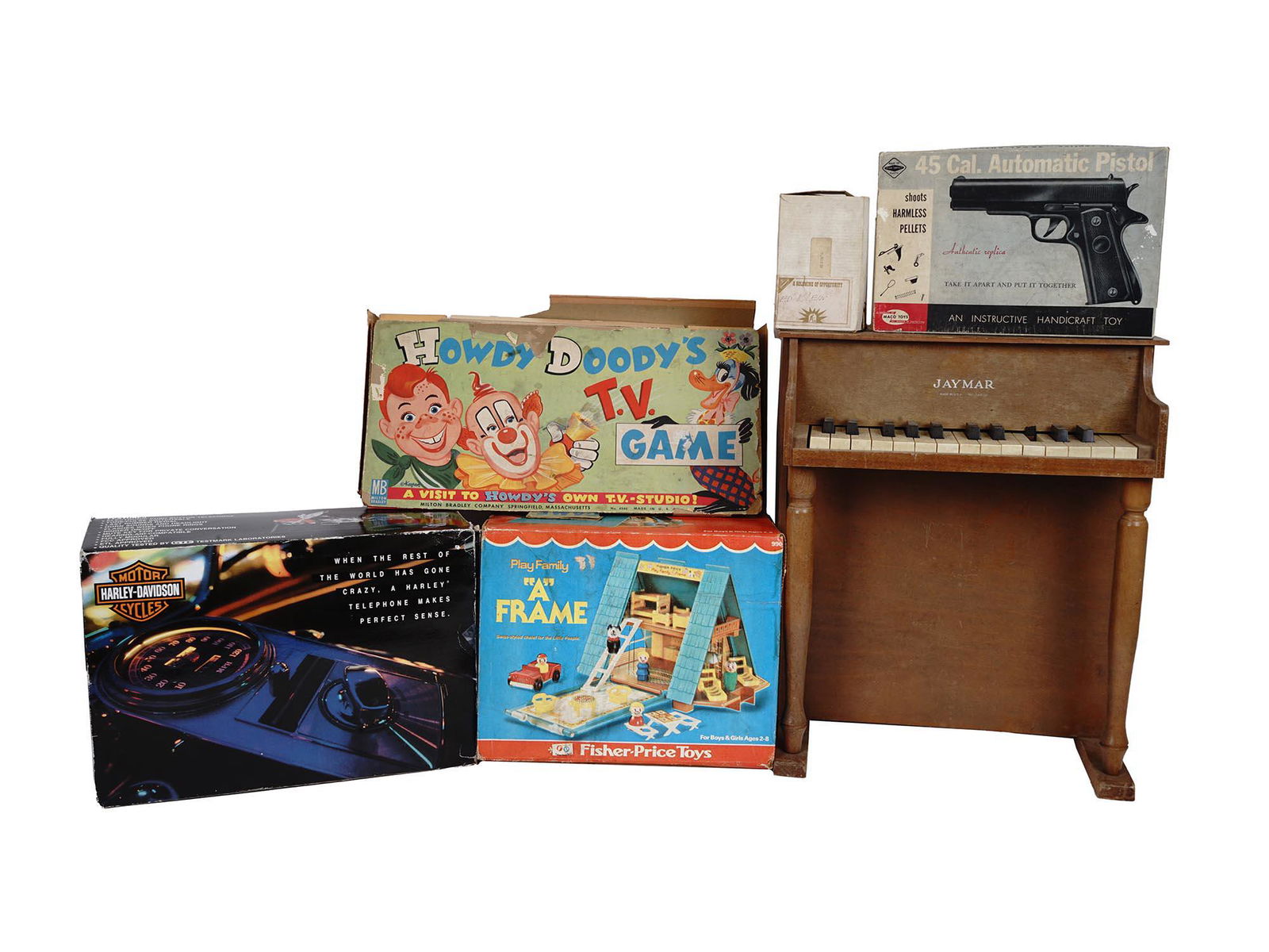 VINTAGE GAMES AND TOYS HOWDY DOODY NABISCO IOB: A lot of mid-century board games and toys in original boxes. A total of six items including Howdy Doody's TV Game, Play Family A Frame, Harley Davidson Telephone, Jaymar mini piano, Maco Toys 45 Cal.