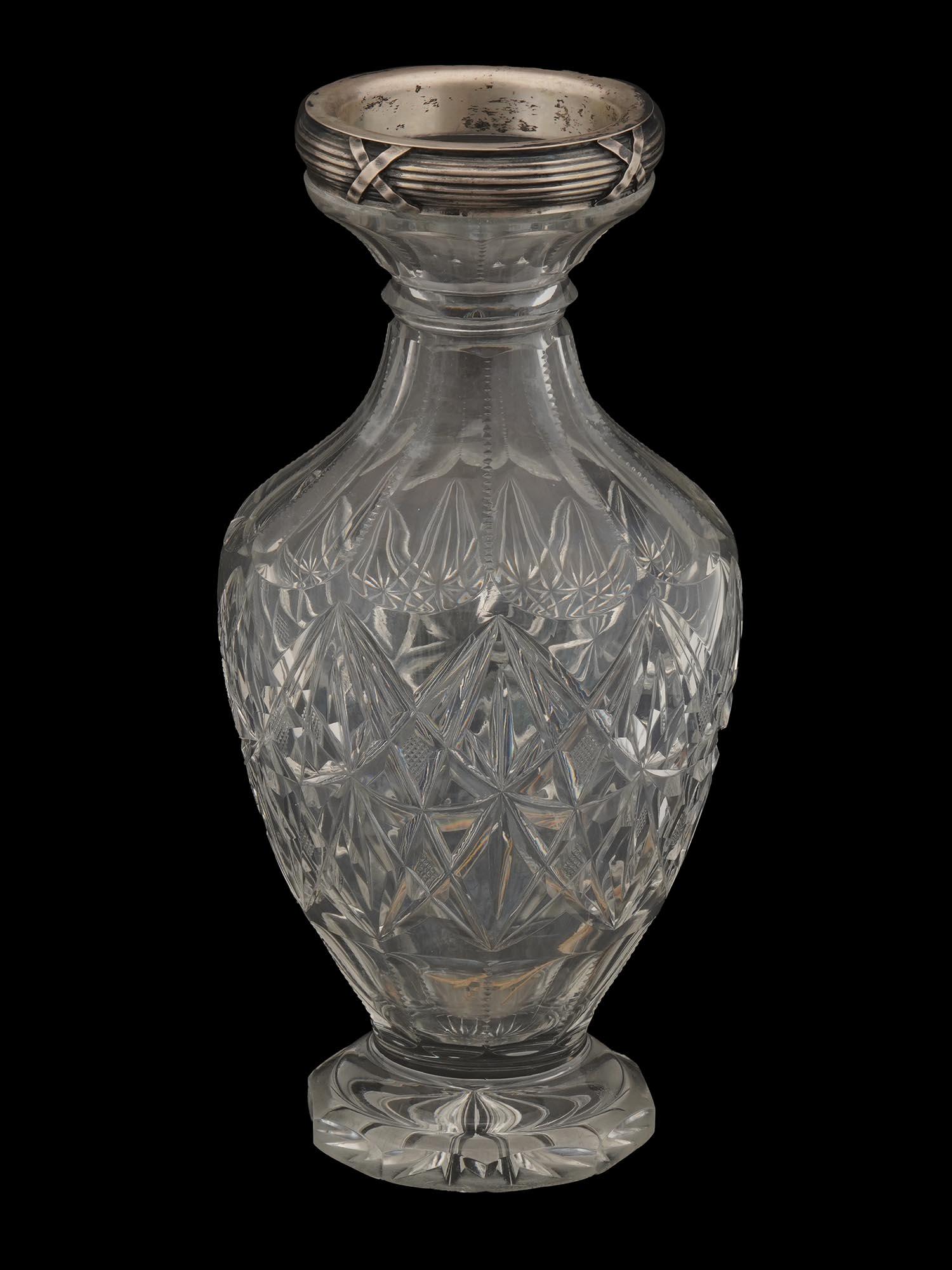 RUSSIAN SILVER CUT CRYSTAL GLASS VASE: Russian silver and crystal cut glass vase by Grachev Brothers Factory. The vase is made in a diamond-cut glass design and adorned with an engraved silver rim. Marked with a standard Silver hallmark an