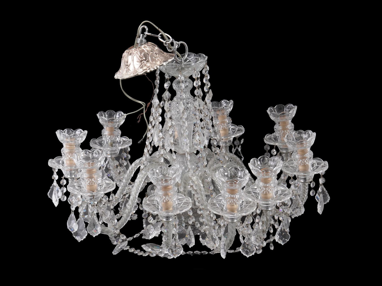 VINTAGE ART NOUVEAU CRYSTAL CUT GLASS CHANDELIER: A vintage Art Nouveau style crystal cut glass chandelier with ten shaped glass arms. The cut crystal body and bobeche, crystal swags and drops. The metal top socket is adorned with an etched floral pa