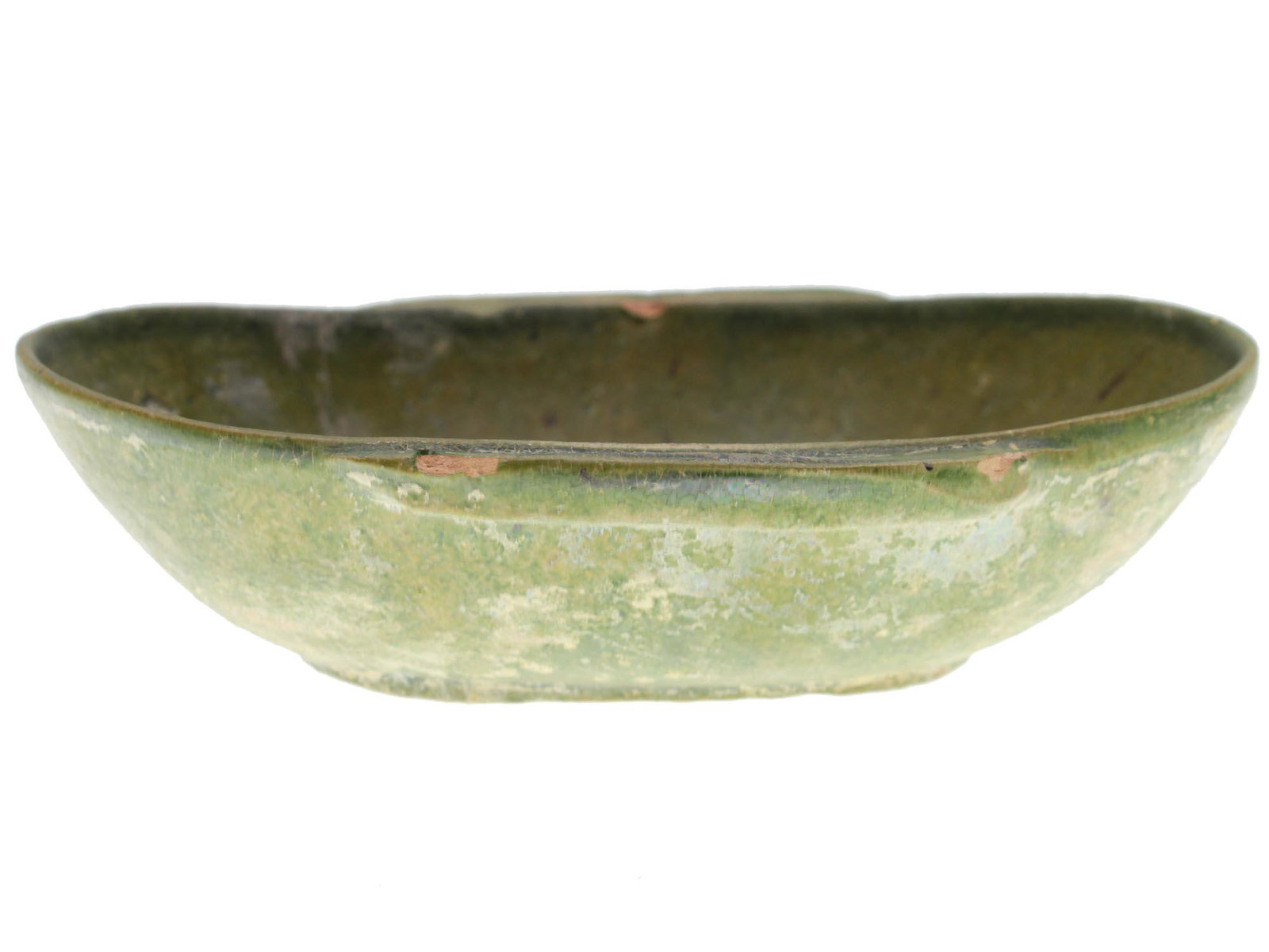 CHINESE HAN DYNASTY WINE CUP: A handcrafted oval bowl with two handles and a ledge on one side. The surface is covered with green glaze.Han-Dynasty (100 B.C.- 100 A.C) Dimensions: L: 5 1/4 in.W: 4 1/4 in.