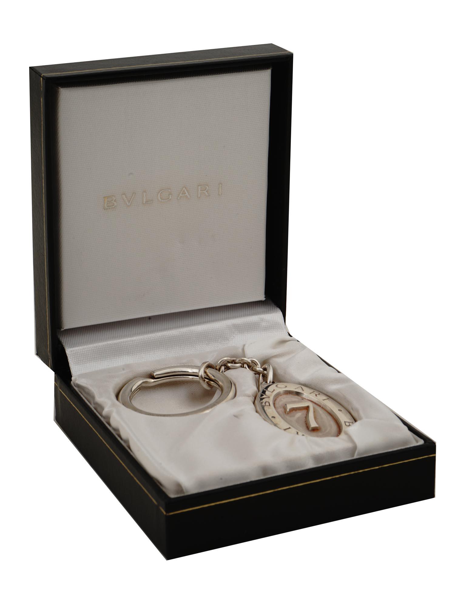 BVLGARI STERLING SILVER LUCKY SEVEN KEYCHAIN: A vintage Bvlgari sterling silver oval keychain. The keychain is adorned with the Lucky Seven 7 logo. Comes in a fitted Bulgari box with tags. Marked with a 925 Sterling Silver hallmark, and other Ass