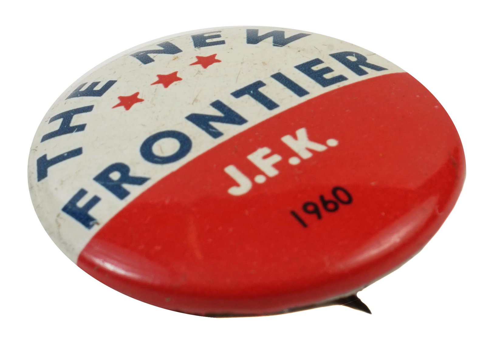 AMERICAN JFK NEW FRONTIER POLITICAL CAMPAIGN PIN: A vintage American political campaign pin. The pin is inscribed, J.F.K. The New Frontier 1960. During John F. Kennedys presidential acceptance speech in 1960, he used the term, New Frontier, when desc