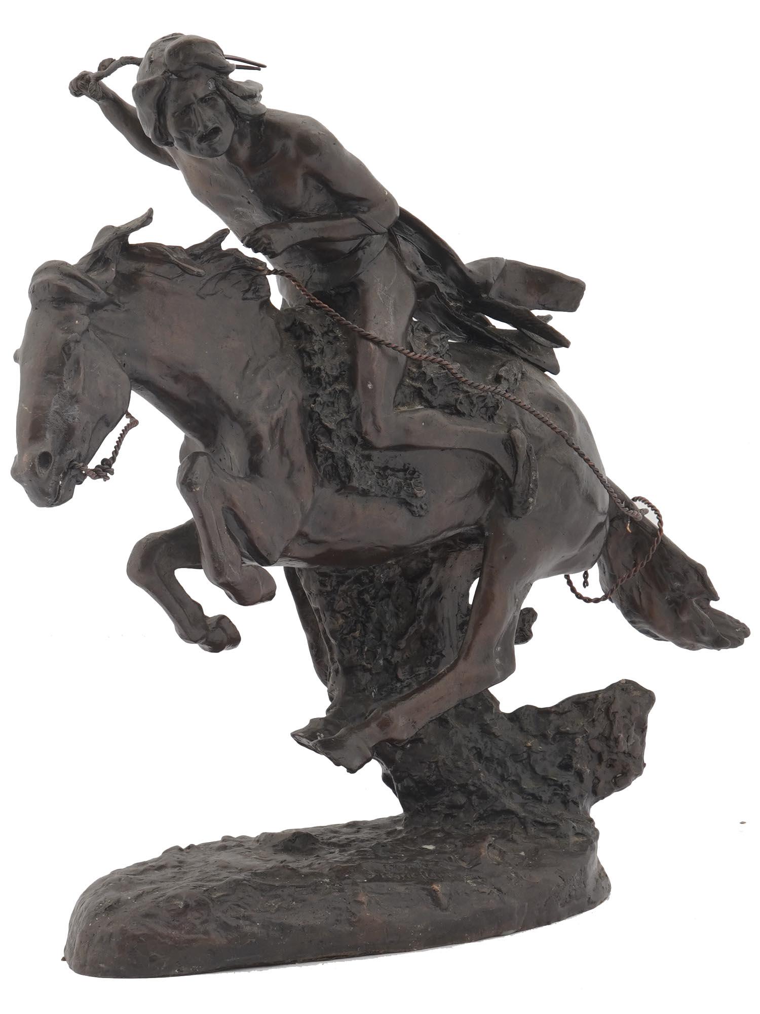 BRONZE INDIAN ON HORSEBACK FIGURINE AFTER REMINGTON: A bronze figurine representing a Native American rider going on the attack. A modern copy of an artwork titled Cheyenne, circa 1900s, by Frederic Sackrider Remington, 1861-1909, an American artist who