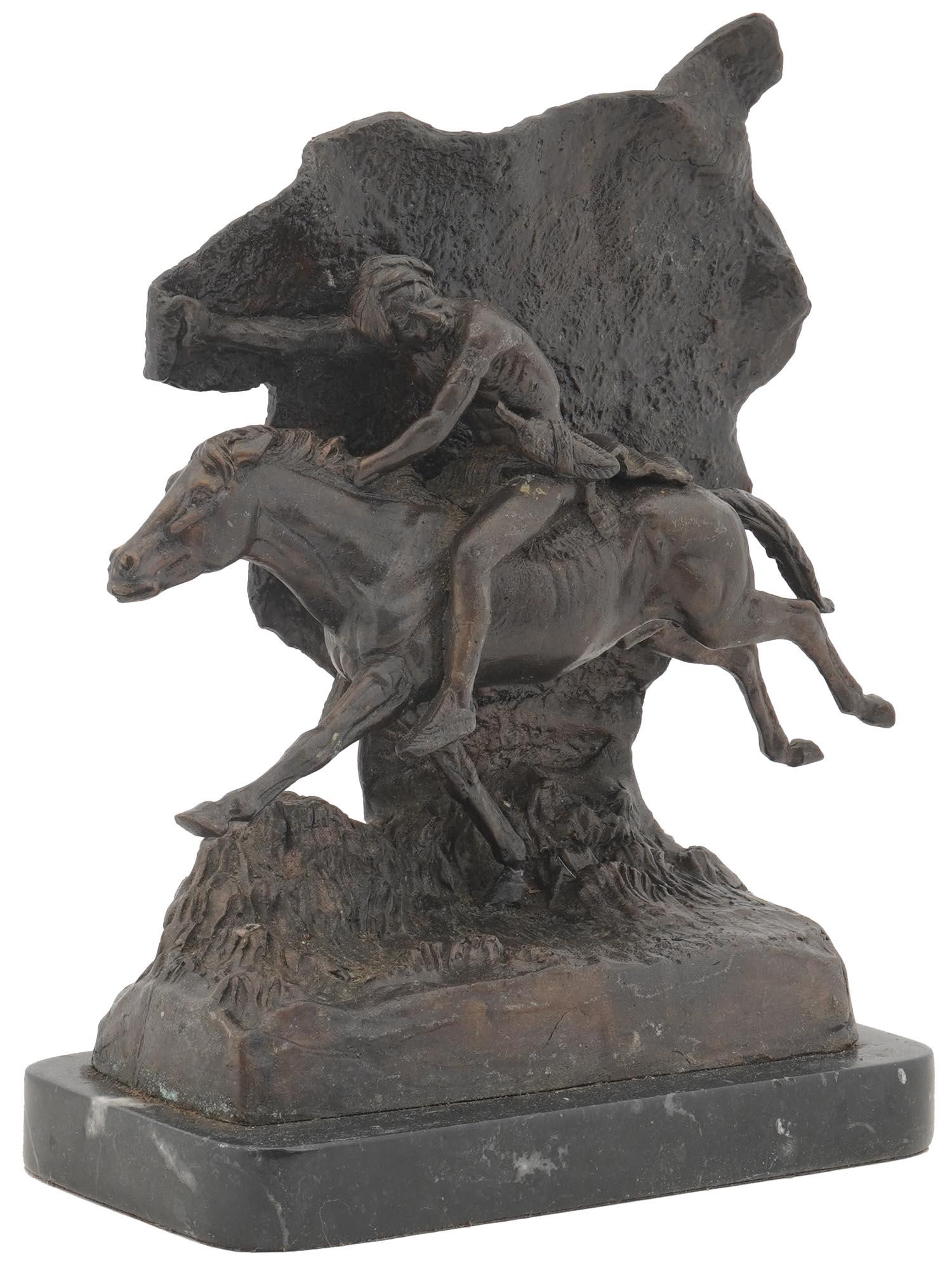 NATIVE AMERICAN BRONZE SCULPTURE AFTER REMINGTON: A Modern Southwestern bronze sculpture, Native Rider, depicts a Native Indian riding at full speed, after Frederic Remington, American, 1861 to 1909. Inscribed on the back. Mounted to a marble stand.
