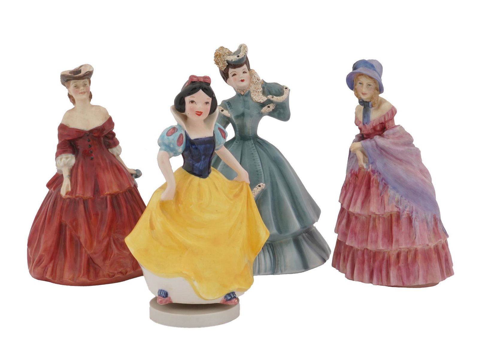 MID CENTURY PORCELAIN CERAMIC FIGURINES MUSIC BOX: A collection of three vintage mid 20th century figurines and one music box. The collection includes a Royal Doulton collectible porcelain figurine Vivienne depicting a beautiful lady wearing a red dre