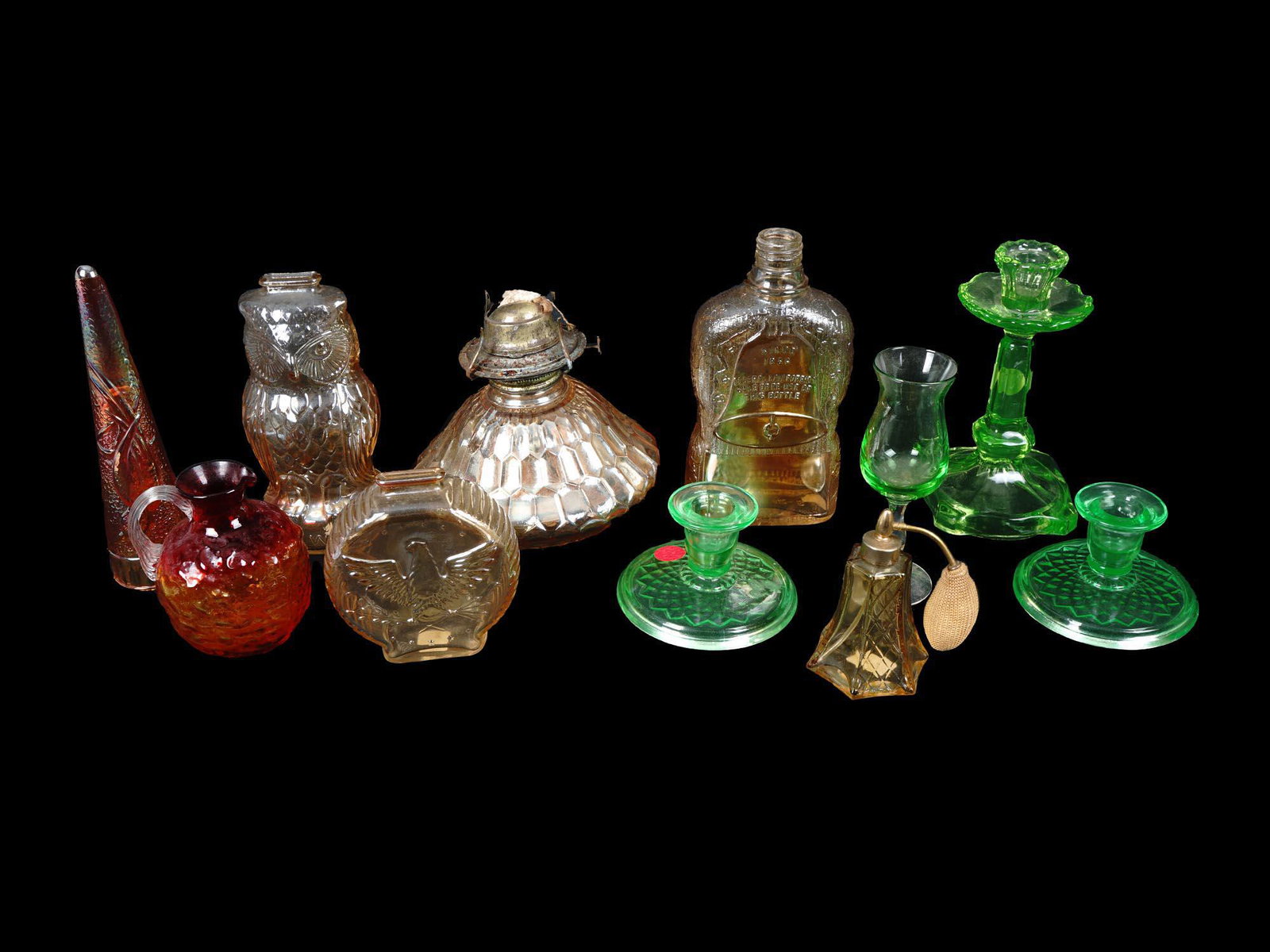 GREEN & AMBER EARLY AMERICAN PRESSED GLASS DECOR: A big lot of early American pressed glass decor items. A total of 11 items including vases, candlesticks, centerpieces a perfume bottle. Green, amber, and red glass colors. Manufactured by The Dugan G